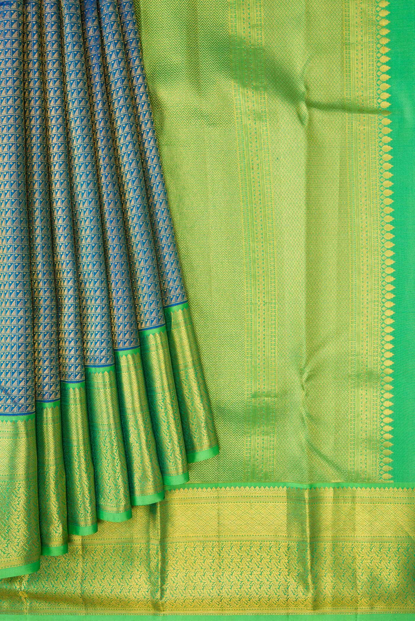 Pleats and pallu of Peacock Blue Dual Tone Kanchipuram Silk Saree with Zari Brocade on the body and Zari Border. 