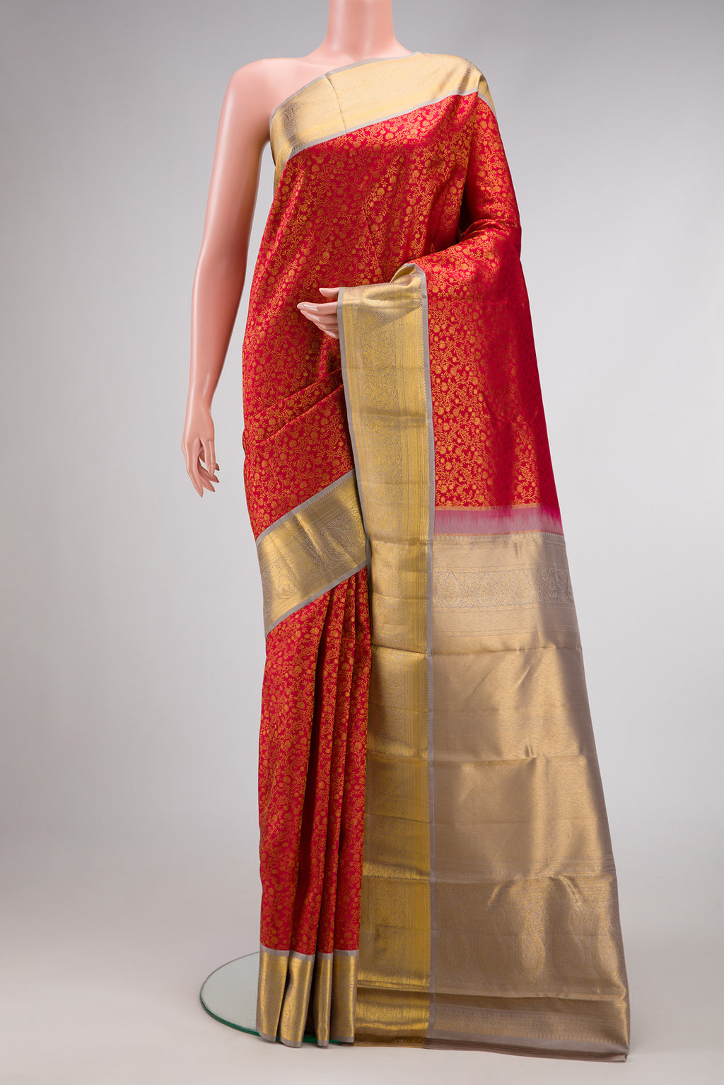 Red Dual Tone Kanjivaram Silk Saree with Zari Brocade on the body and Zari Border.  displayed on a mannequin