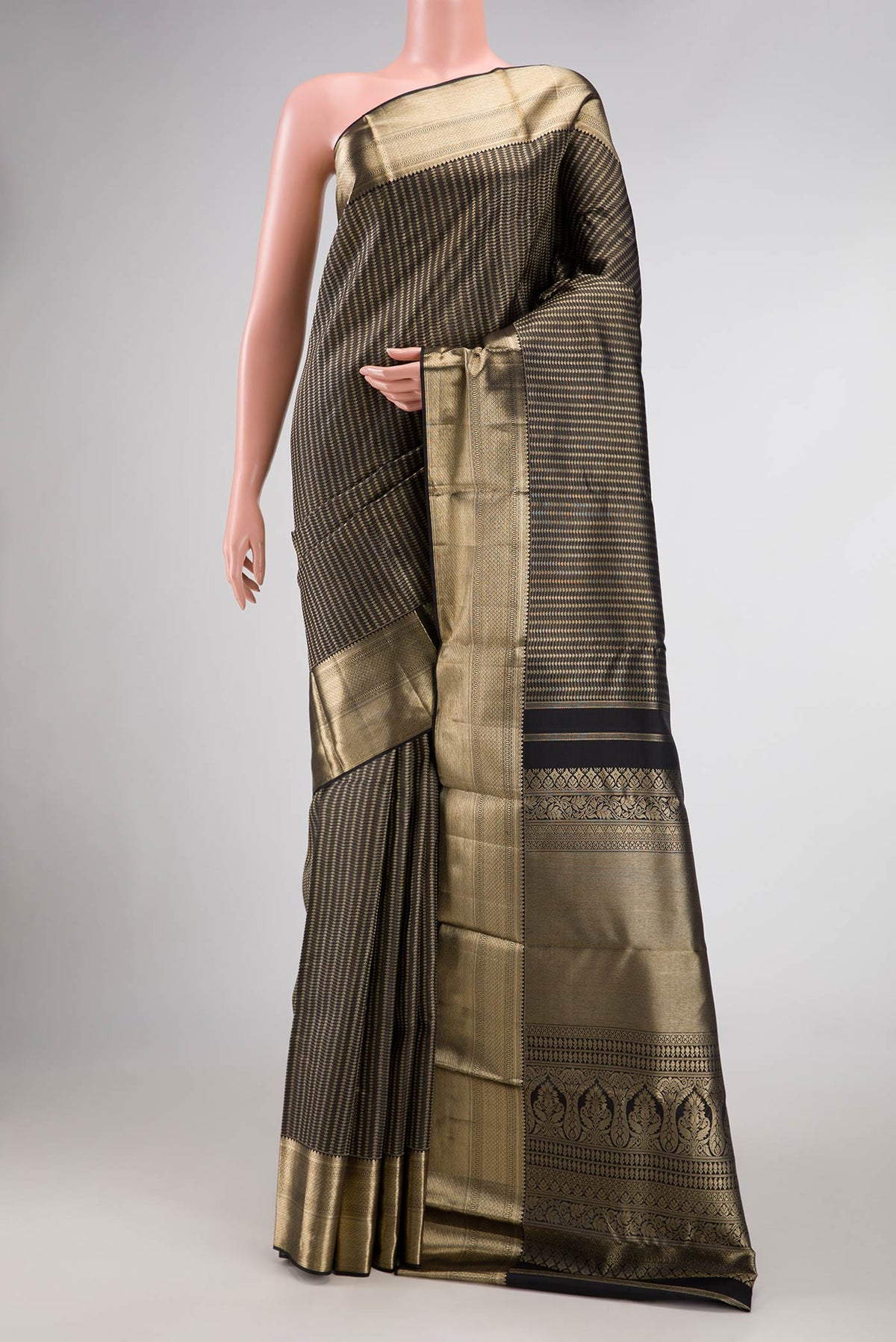 Black Dual Tone Kanjivaram Silk Saree with Zari Brocade on the body and Zari Border.  displayed on a mannequin