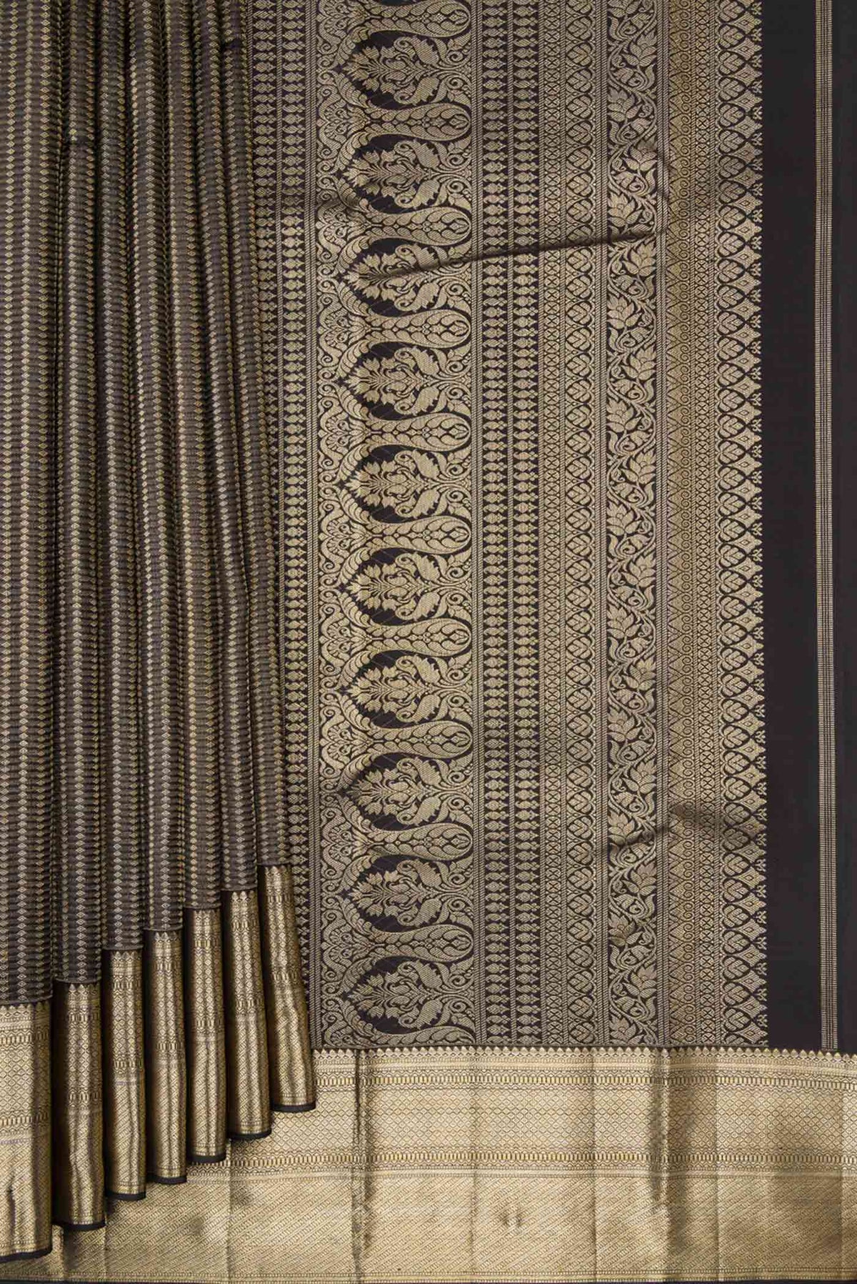 Pleats and pallu of Black Dual Tone Kanjivaram Silk Saree with Zari Brocade on the body and Zari Border. 
