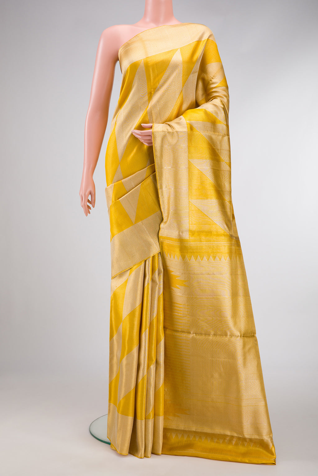 Gold Dual Tone Tissue Silk Saree with Zari Brocade on the body and Zari Border.  displayed on a mannequin