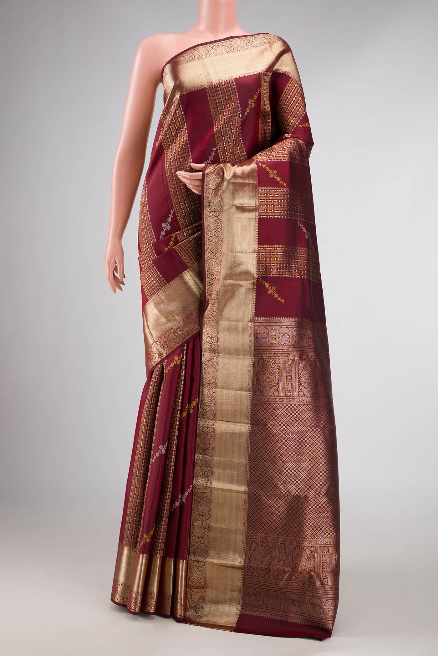 Maroon Dual Tone Kanchipuram Silk Saree with Zari Brocade on the body and Zari Border displayed on a mannequin