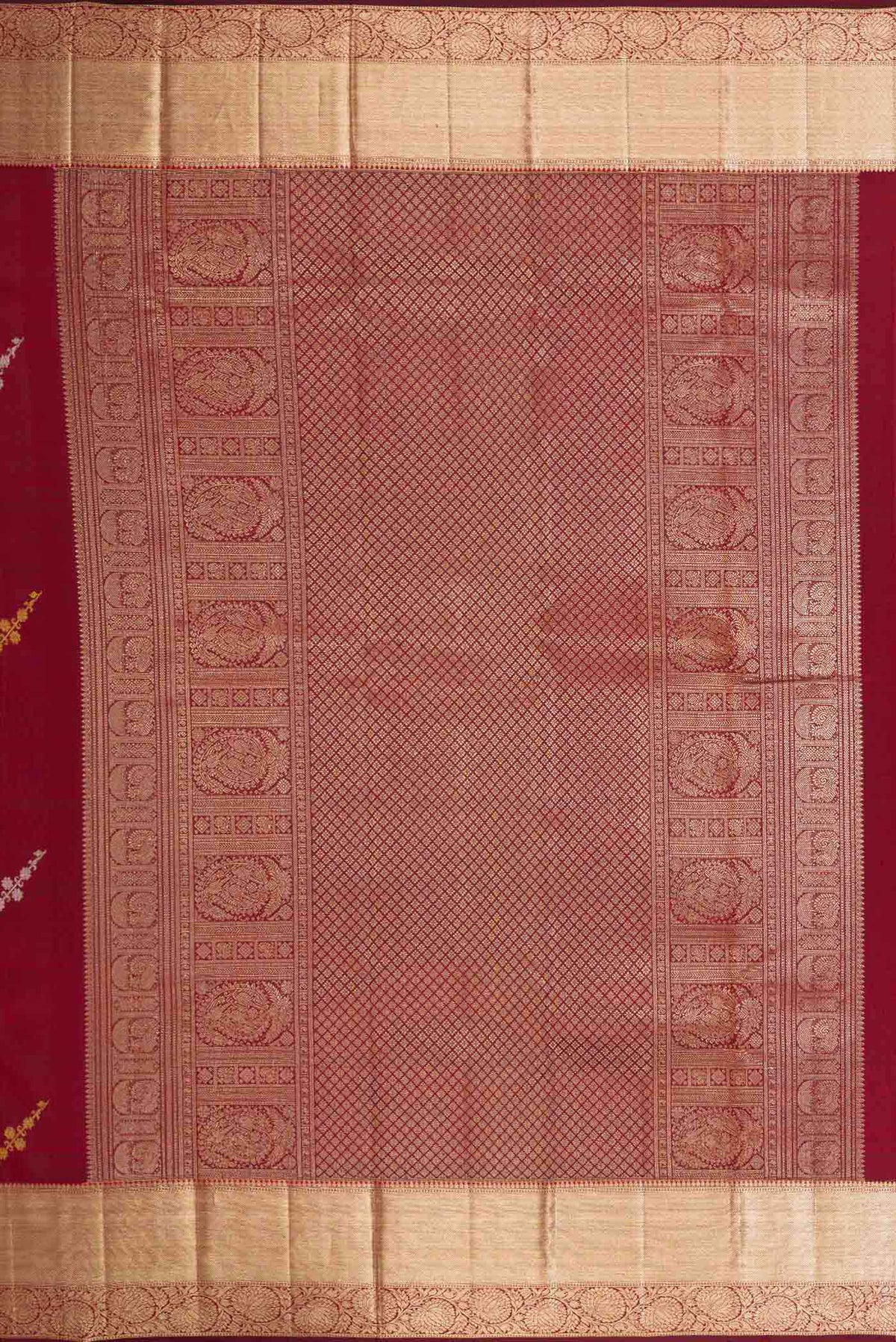 Close up image of the pallu of Maroon Dual Tone Kanchipuram Silk Saree with Zari Brocade on the body and Zari Border