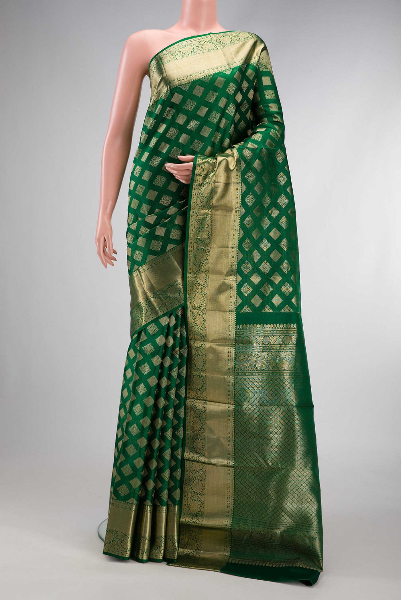 Green Dual Tone Kanchipuram Silk Saree with Zari Brocade on the body and Zari Border.  displayed on a mannequin