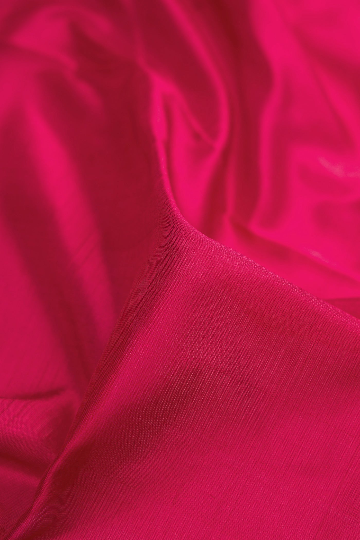 Close up of Maroon Kanjivaram Silk Nine Yards Saree with Plain Body and Zari Border.  displaying folds