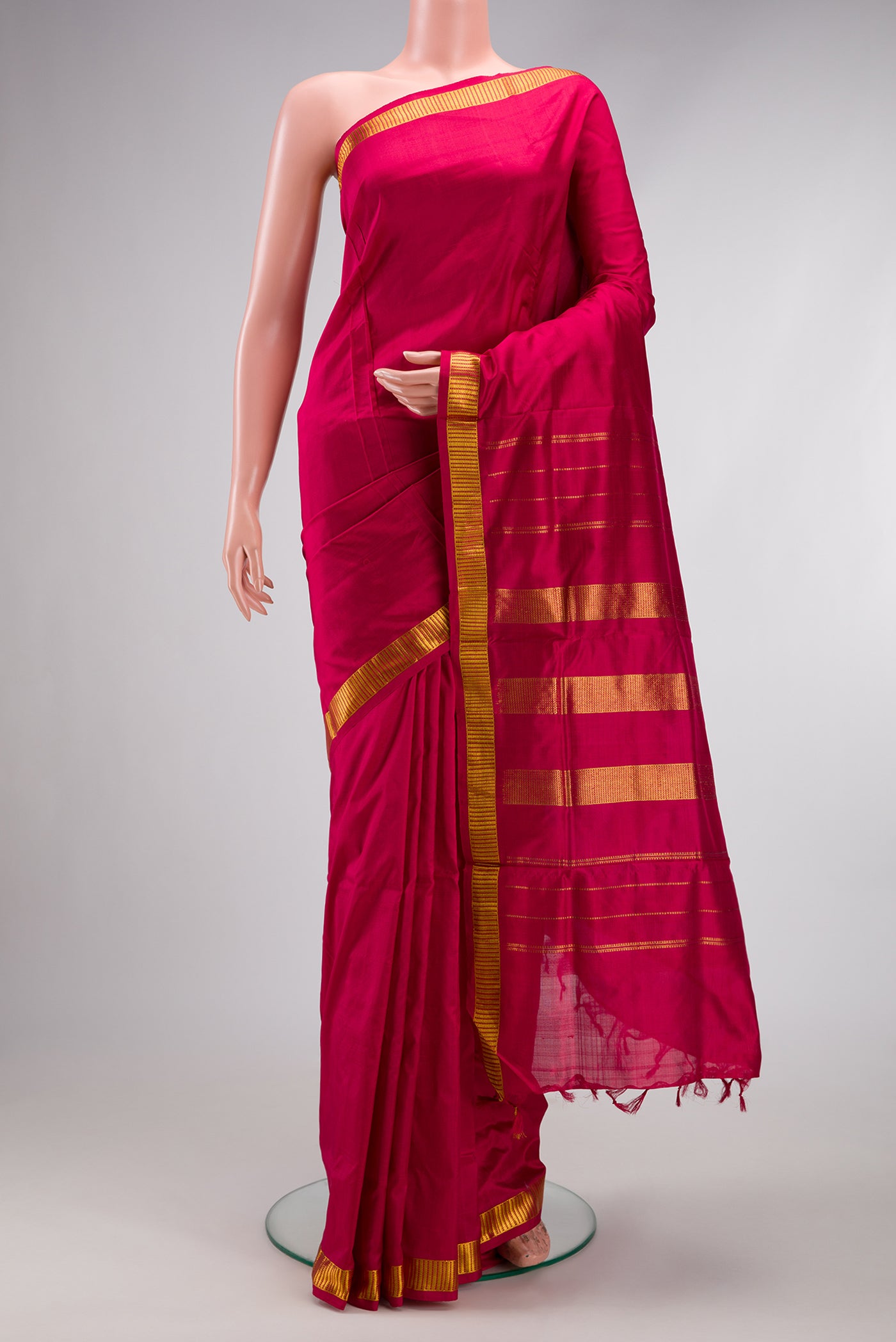 Maroon Kanjivaram Silk Nine Yards Saree with Plain Body and Zari Border.  displayed on a mannequin