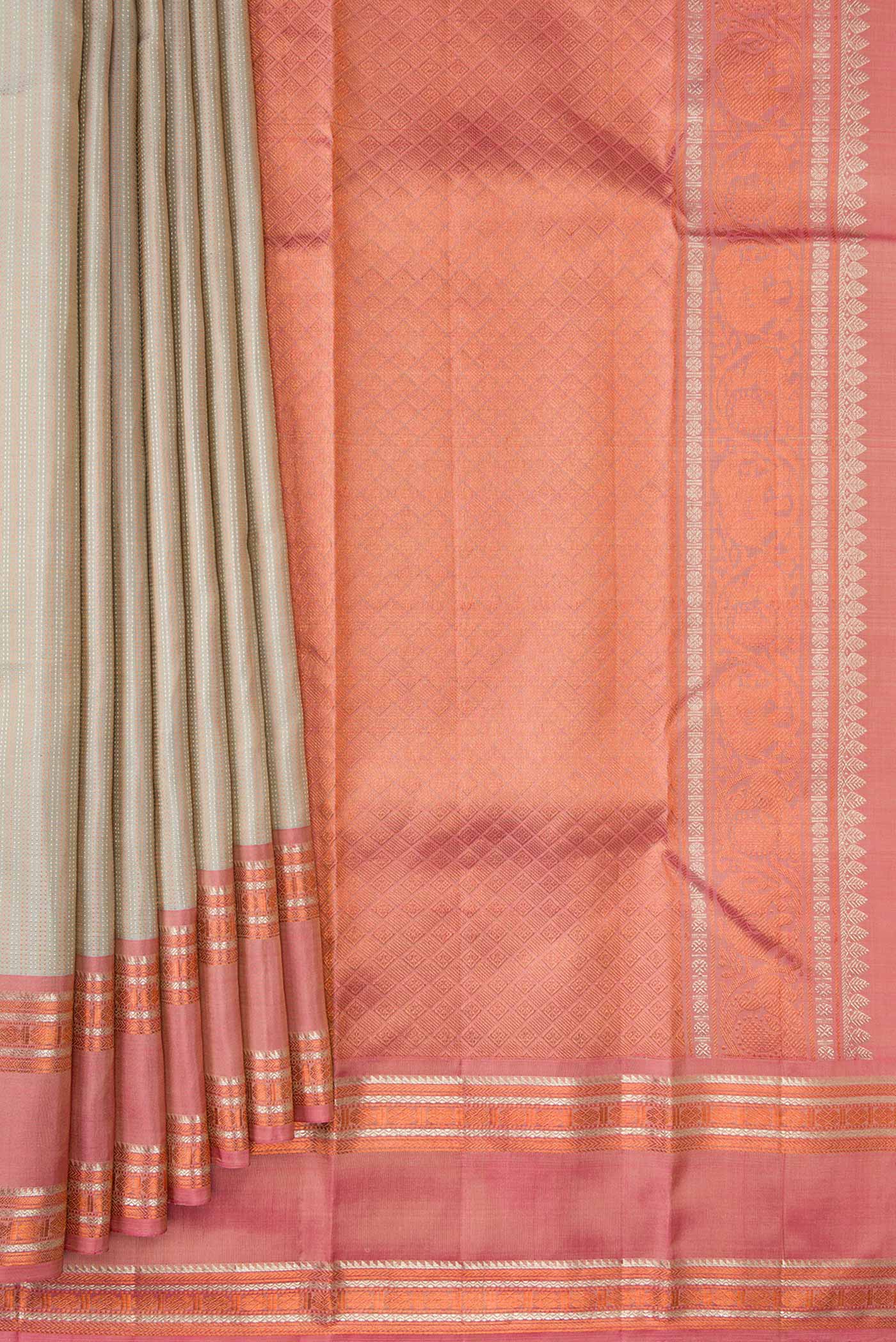 Pleats and pallu of Beige Dual Tone Kanchipuram Silk Saree with Stripes on the body and Zari Border. 