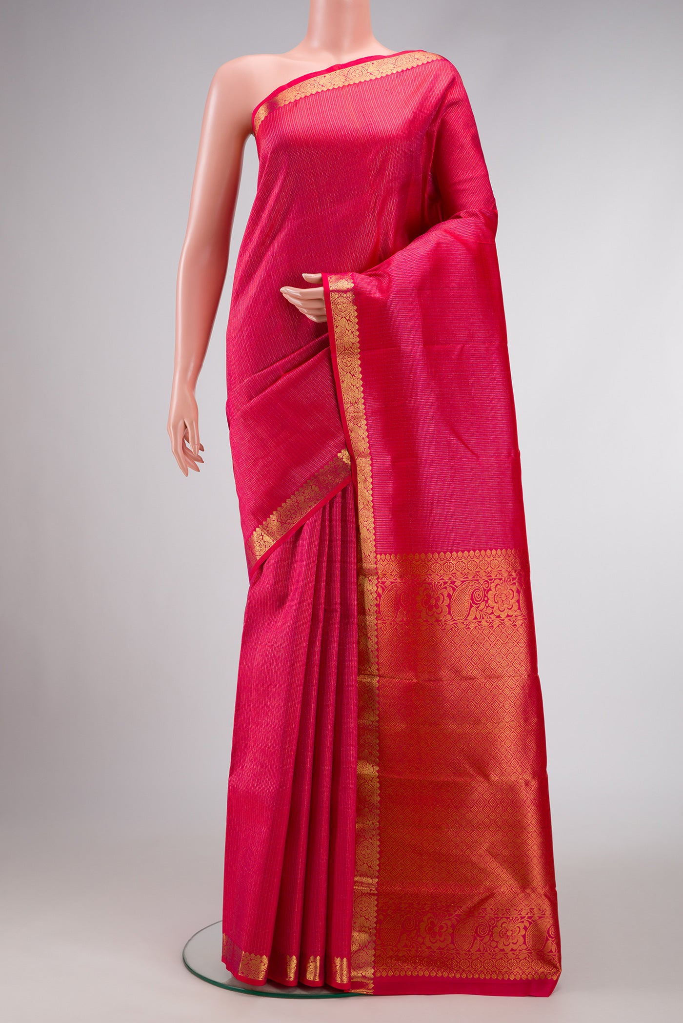 Pink Dual Tone Kanchipuram Silk Saree with Stripes on the body and Zari Border.  displayed on a mannequin