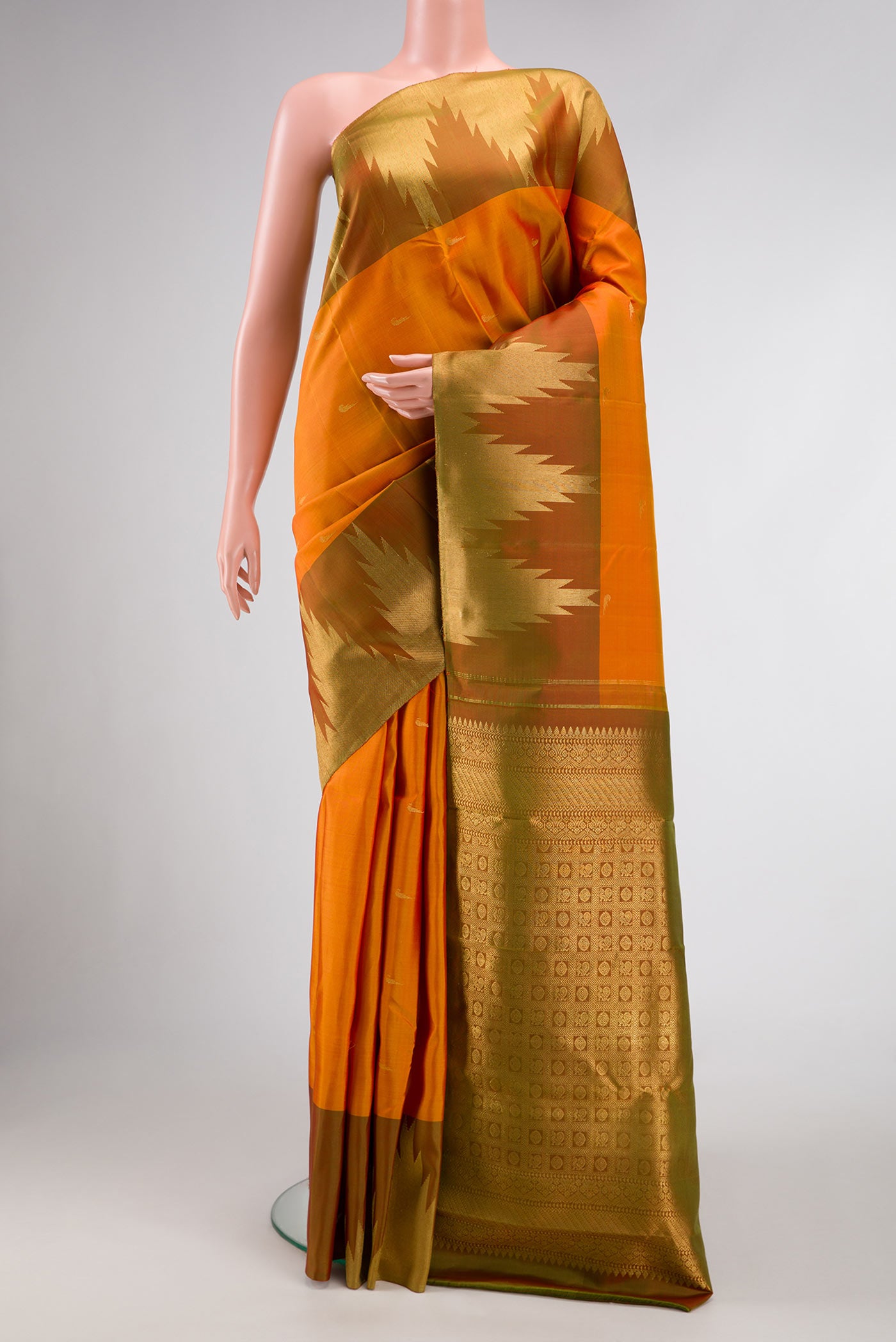 Mustard Dual Tone Kanjivaram Silk Saree with Zari Butta on the body and Temple Border.  displayed on a mannequin