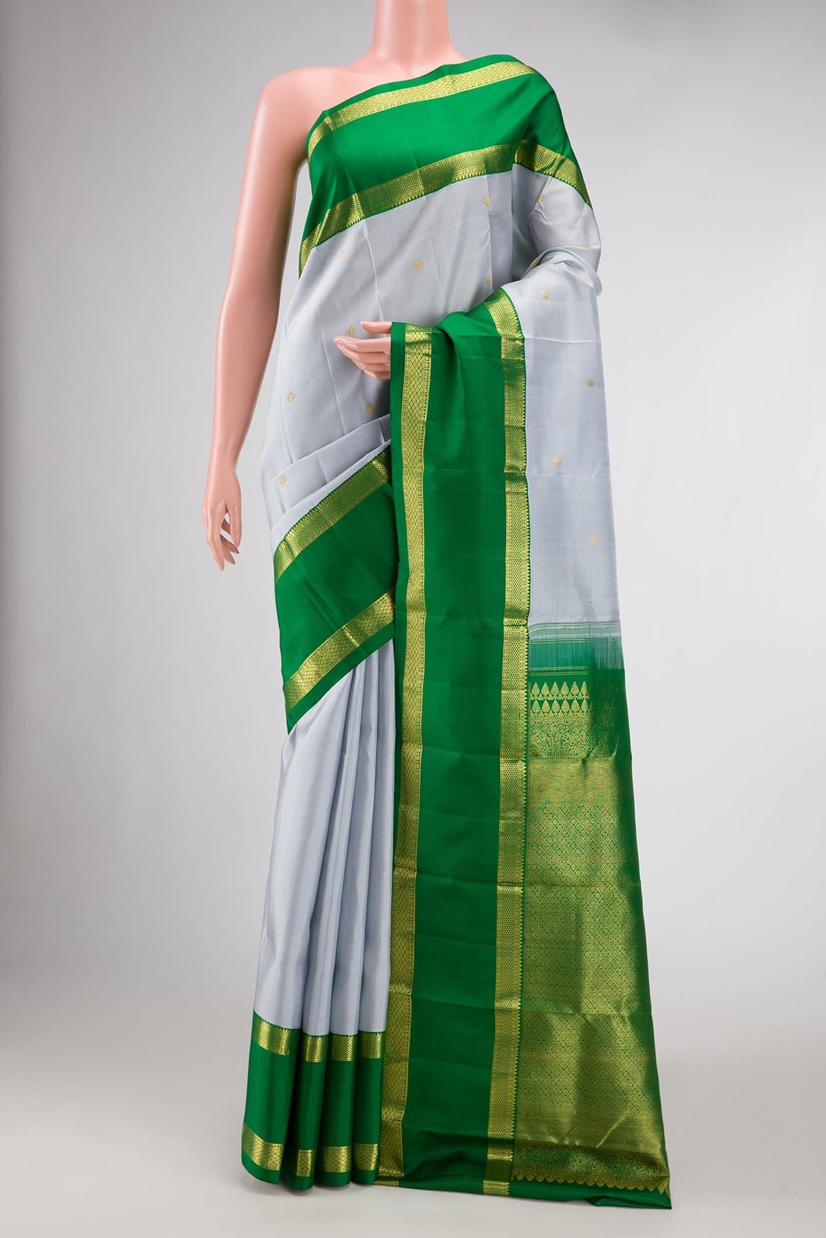Grey Dual Tone Kanjivaram Silk Saree with Zari Butta on the body and Zari Border.  displayed on a mannequin