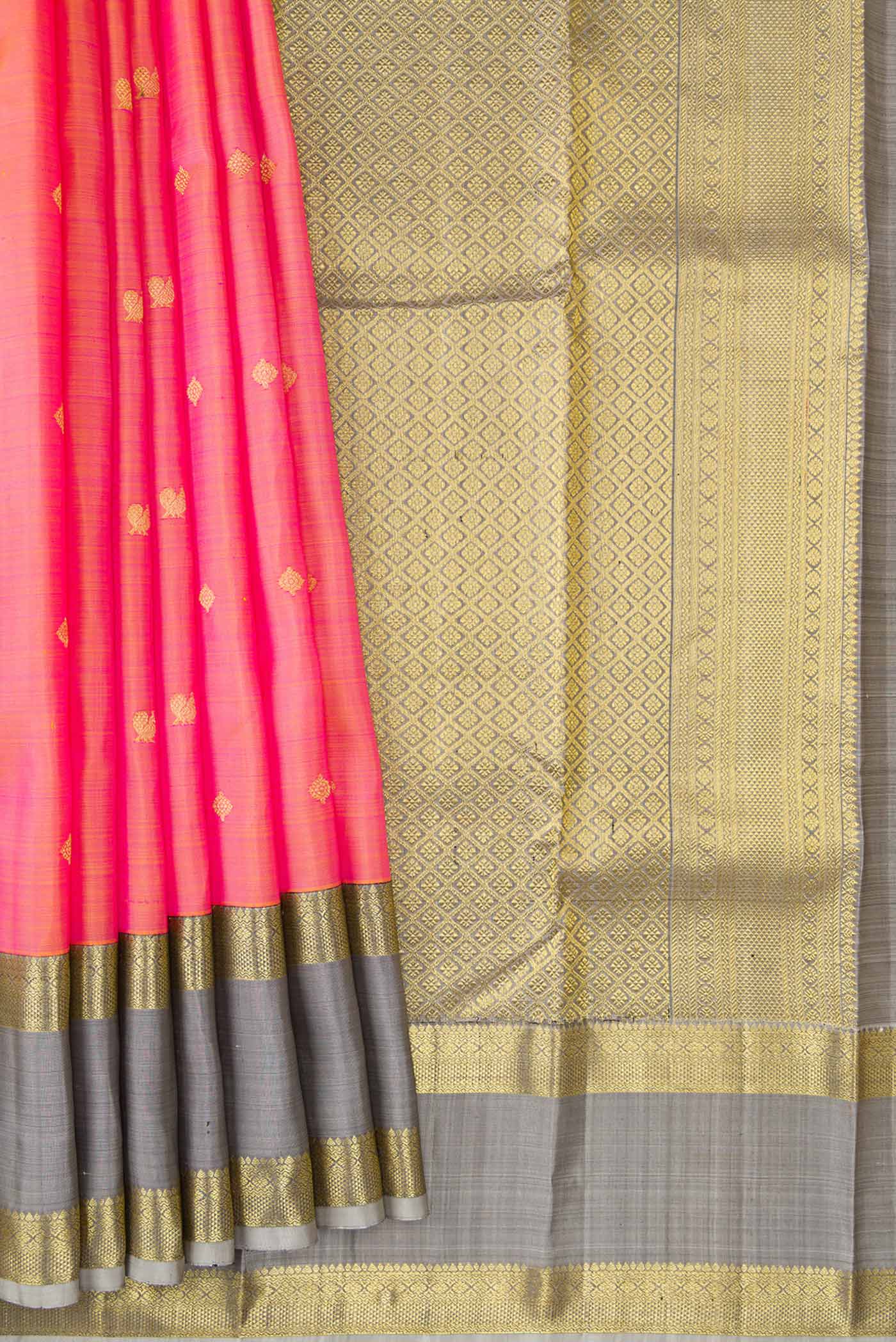 Pleats and pallu of Orange Dual Tone Kanjivaram Silk Saree with Zari Butta on the body and Zari Border. 