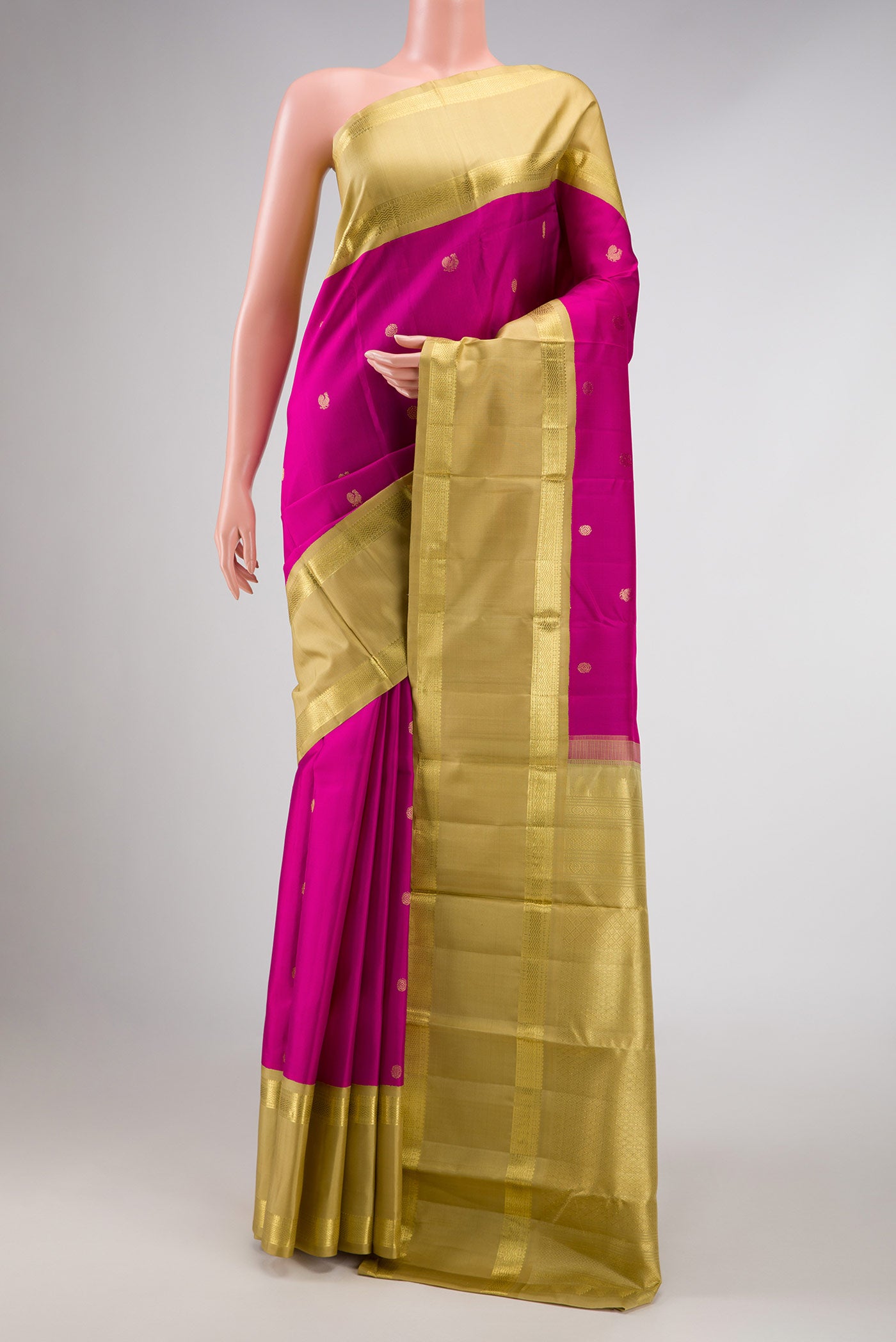 Pink Dual Tone Kanchipuram Silk Saree with Zari Butta on the body and Zari Border displayed on a mannequin