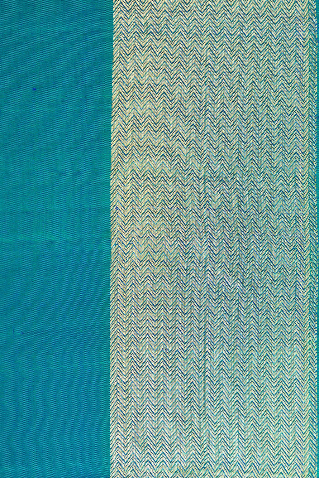 Border image of Peacock Blue Dual Tone Kanjivaram Silk Nine Yards Saree with Plain Body and Zari Border. 