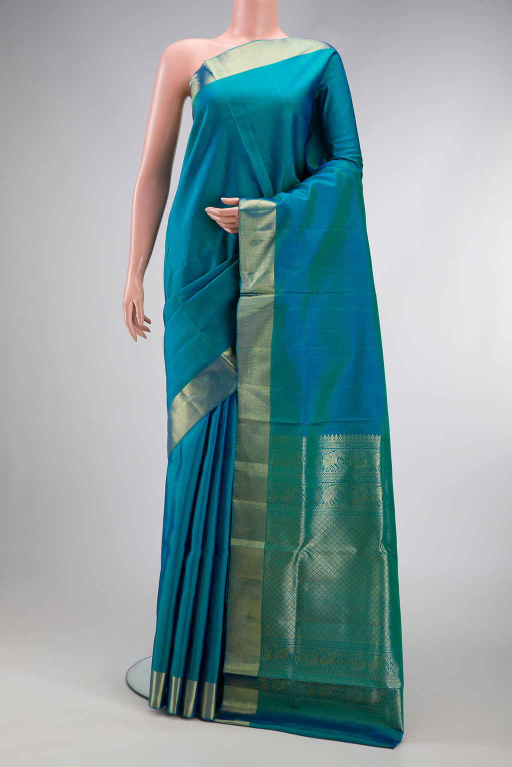 Peacock Blue Dual Tone Kanjivaram Silk Nine Yards Saree with Plain Body and Zari Border.  displayed on a mannequin