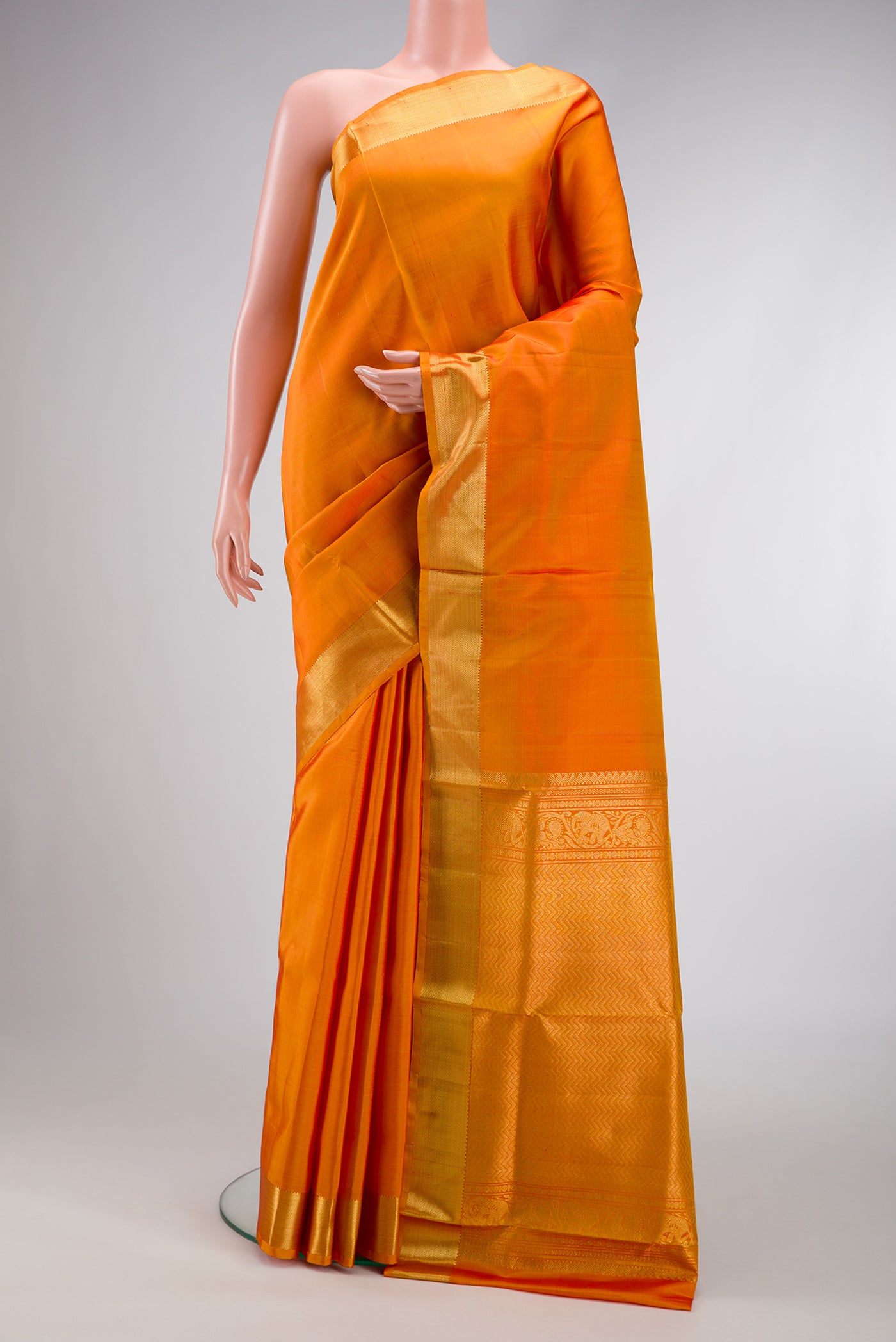 Orange Dual Tone Kanjivaram Silk Nine Yards Saree with Plain Body and Zari Border.  displayed on a mannequin