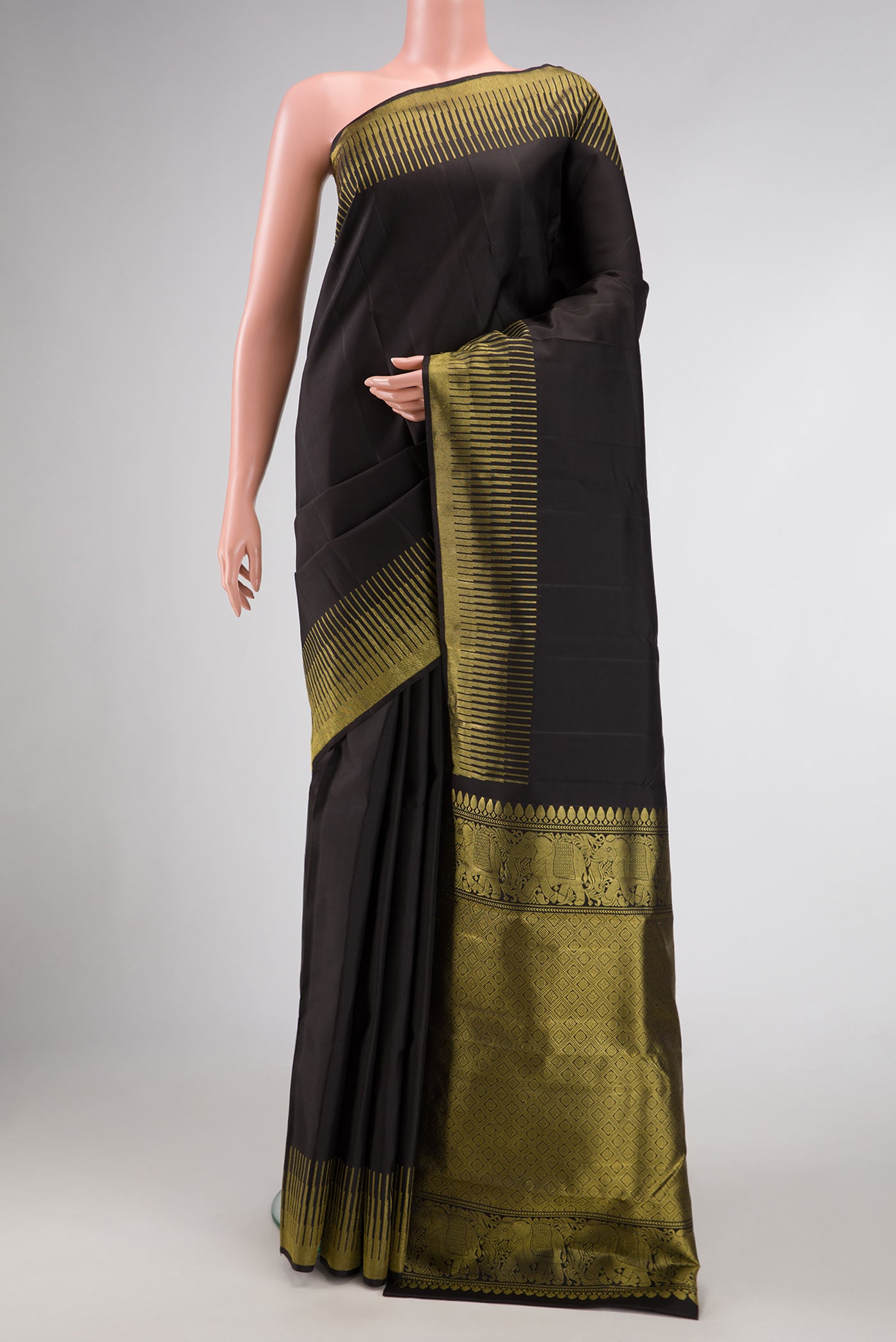 Black Dual Tone Kanchipuram Silk Saree with Plain Body and Fancy Border.  displayed on a mannequin