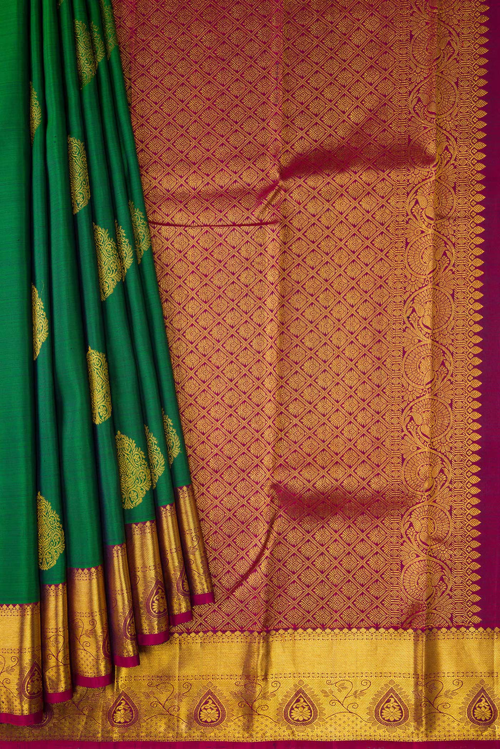 Pleats and pallu of Green Dual Tone Kanjivaram Silk Saree with Zari Butta on the body and Zari Border. 
