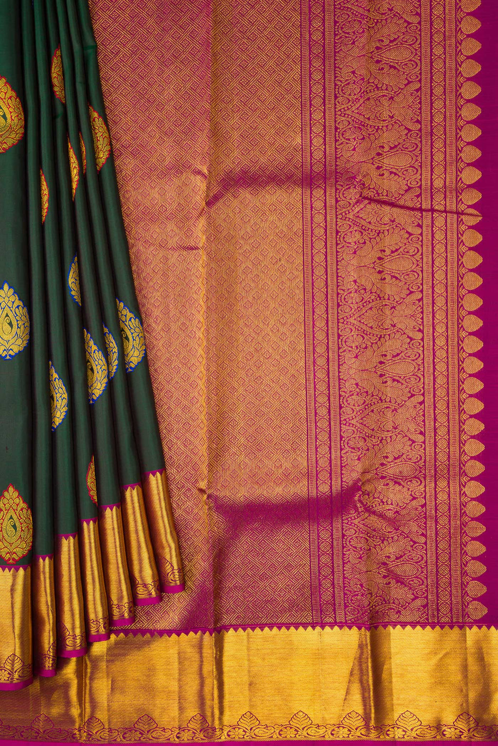 Pleats and pallu of Green Dual Tone Kanchipuram Silk Saree with Zari And Thread Butta on the body and Zari Border. 