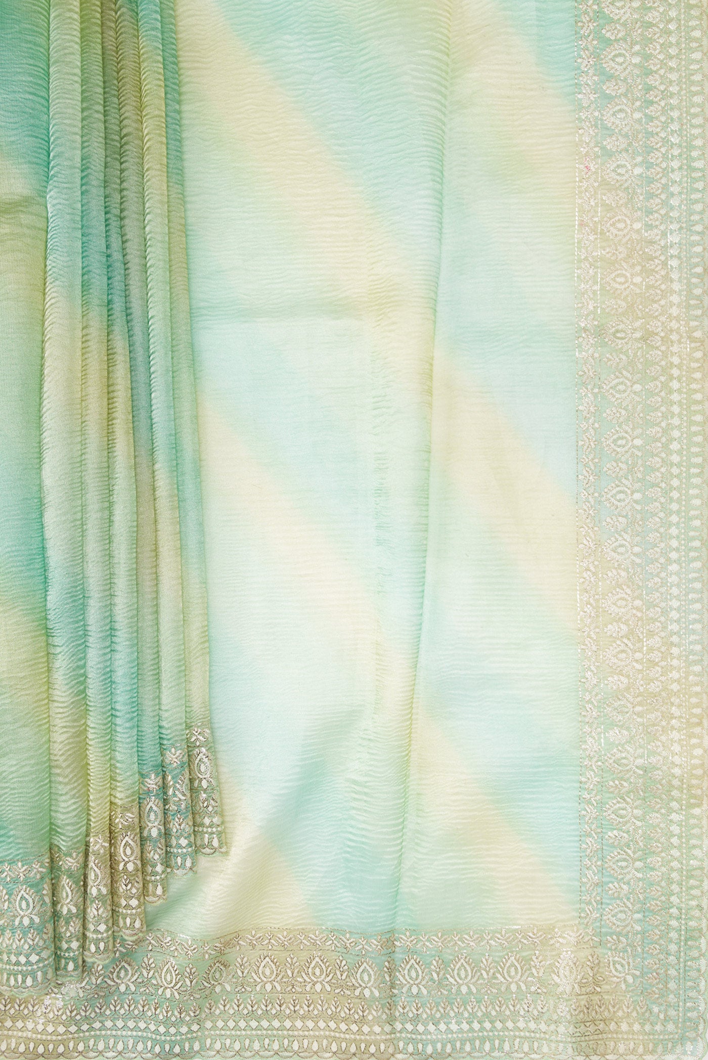 Pleats and pallu of Pista Green Dual Tone Organza Silk Saree with Stripes on the body and Embroidery Border. 