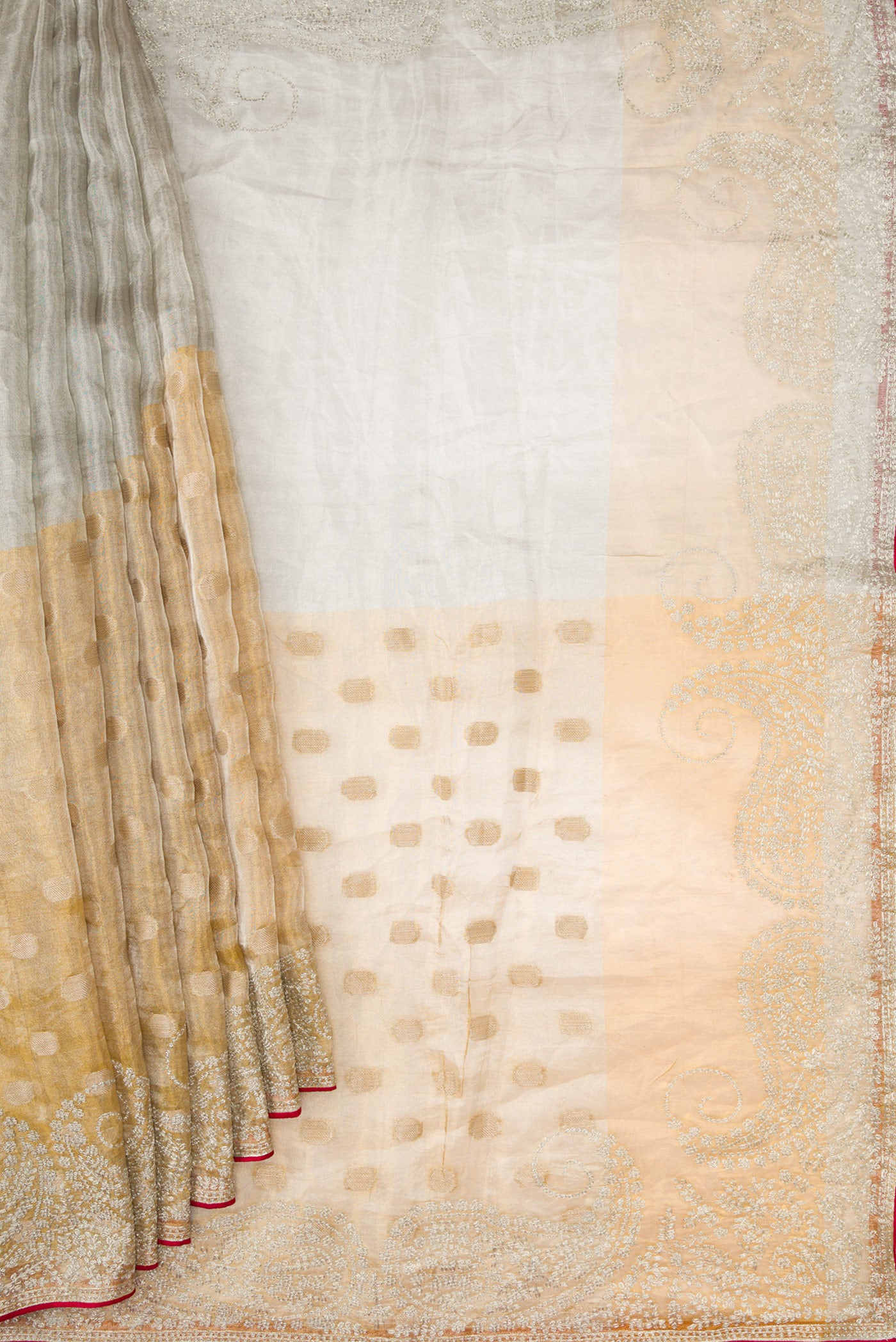 Pleats and pallu of Gold Dual Tone Organza Silk Saree with Zari Butta on the body and Embroidery Border. 