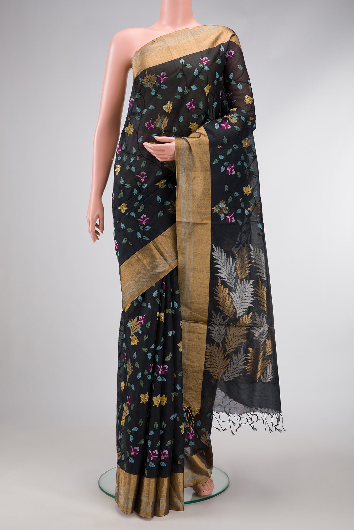 Black Dual Tone Tussar Silk Saree with Embroidery on the body and Zari Border.  displayed on a mannequin