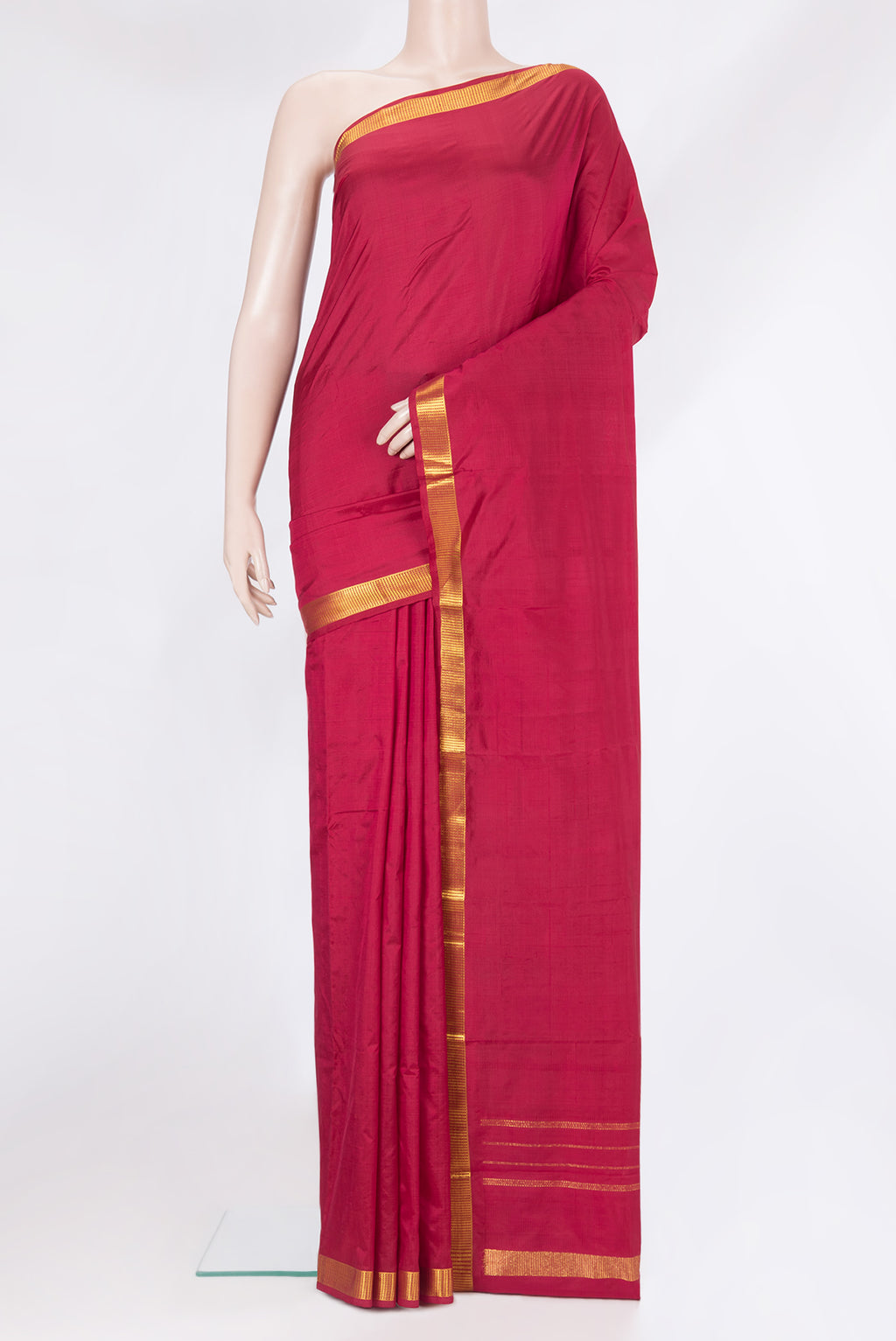 Maroon Kanjivaram Silk Saree with Plain Body and Zari Border.  displayed on a mannequin