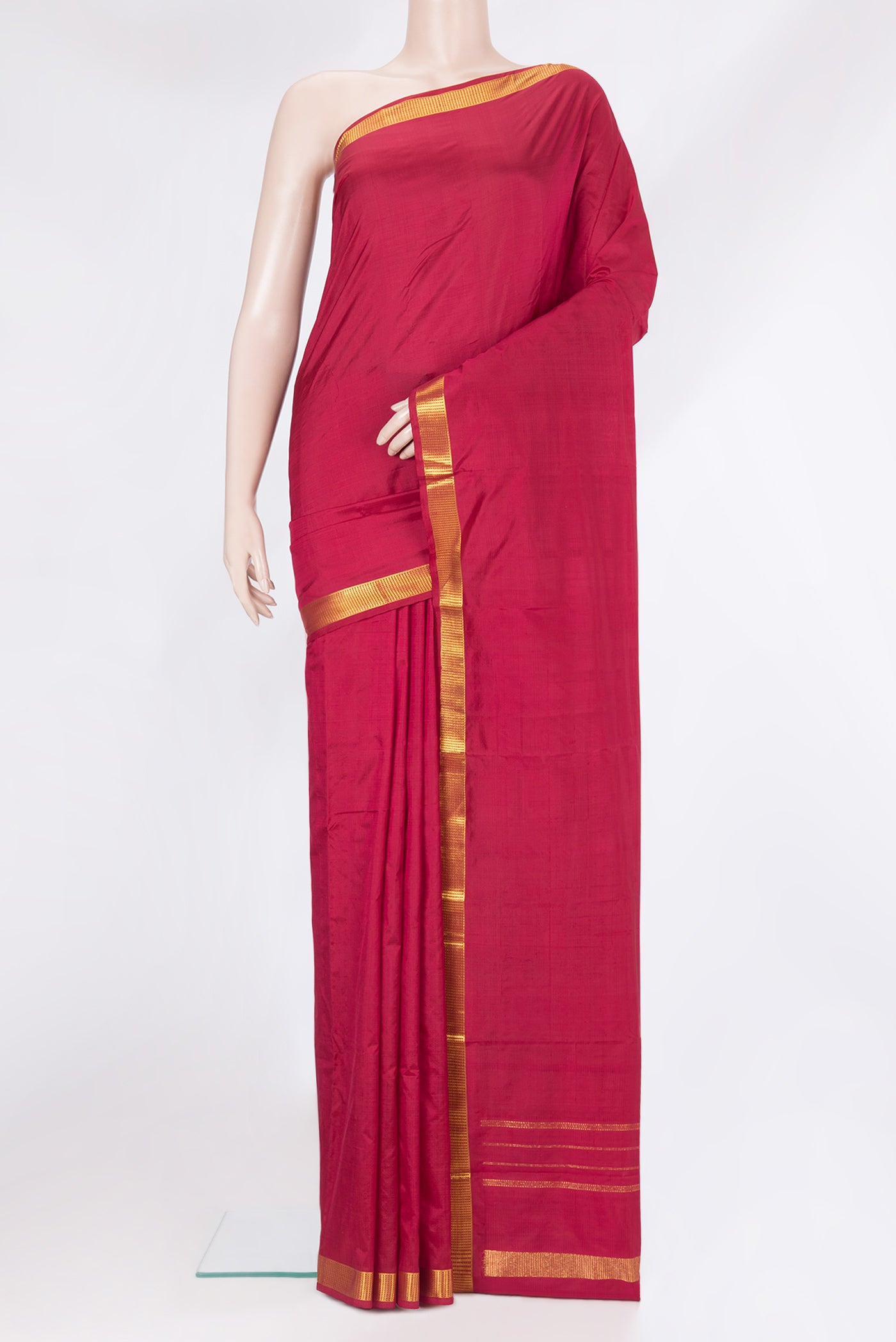Maroon Kanjivaram Silk Saree with Plain Body and Zari Border.  displayed on a mannequin