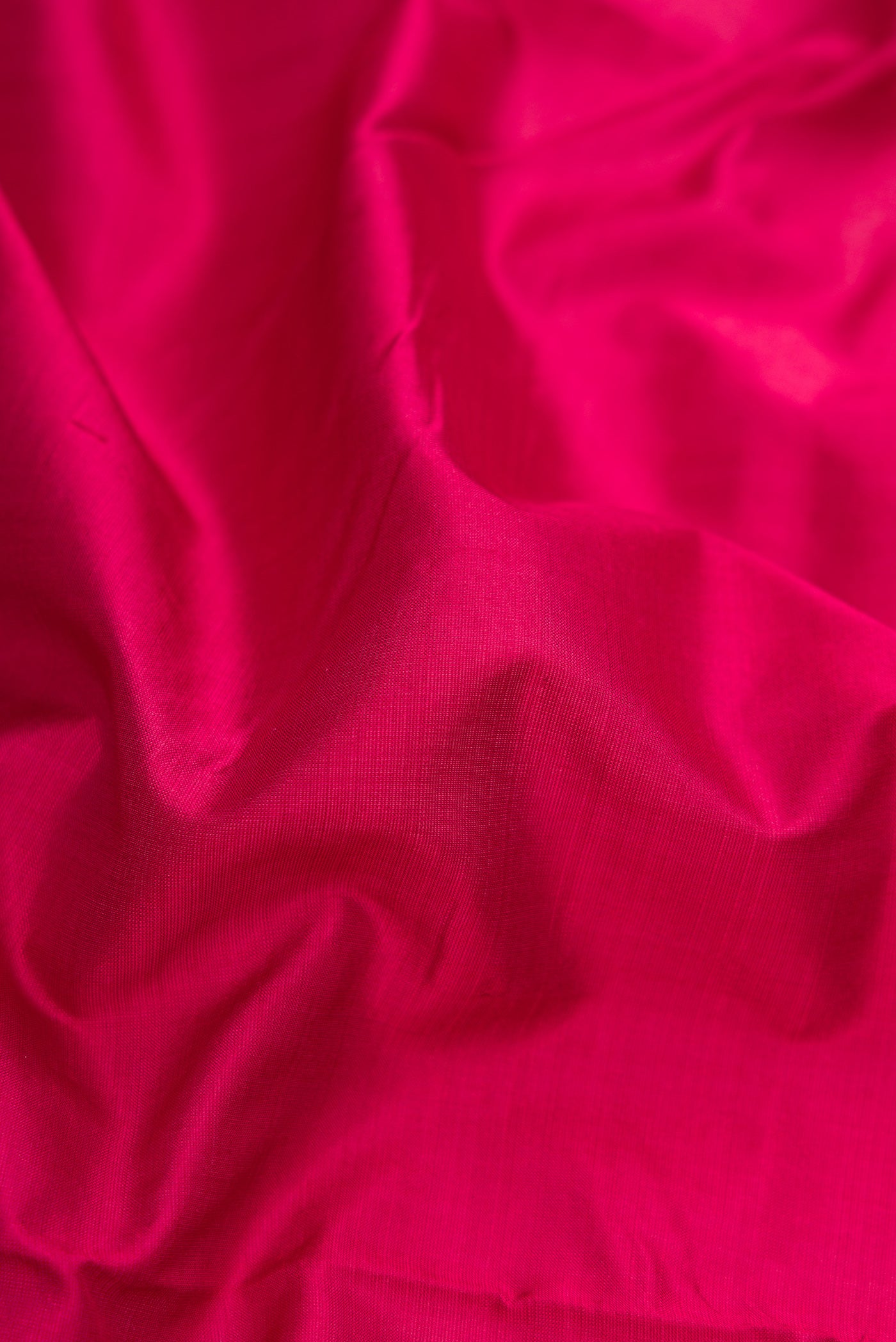 Close up of Maroon Dual Tone Kanjivaram Silk Nine Yards Saree with Plain Body and Zari Border.  displaying folds
