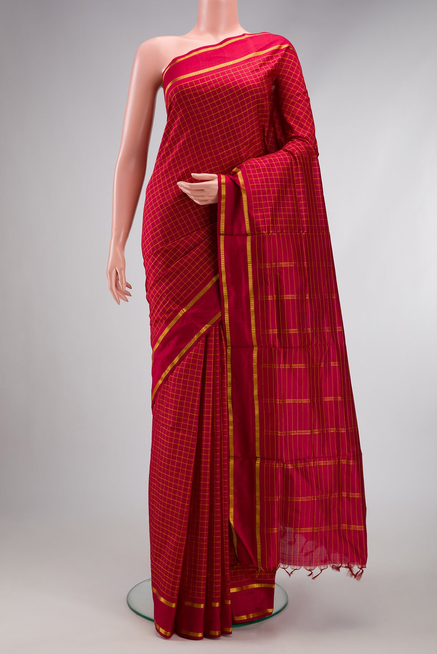 Maroon Kanchipuram Silk Nine Yards Saree with Checked design on the body and Zari Border.  displayed on a mannequin