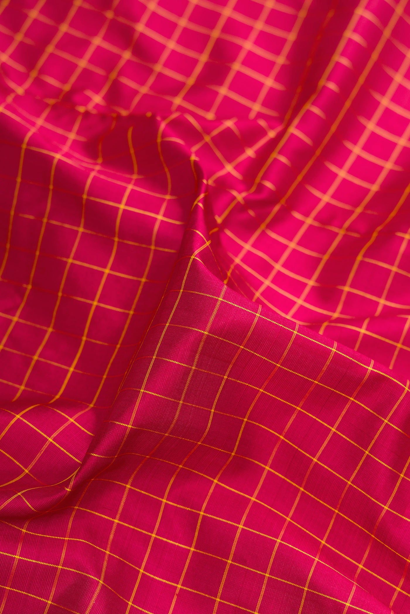 Close up of Maroon Dual Tone Kanjivaram Silk Nine Yards Saree with Checked design on the body and Zari Border.  displaying folds