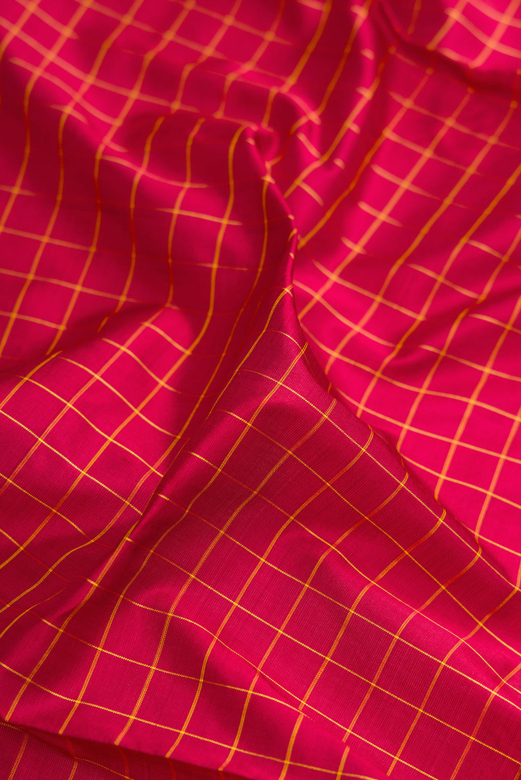 Close up of Maroon Kanjivaram Silk Nine Yards Saree with Checked design on the body and Zari Border.  displaying folds