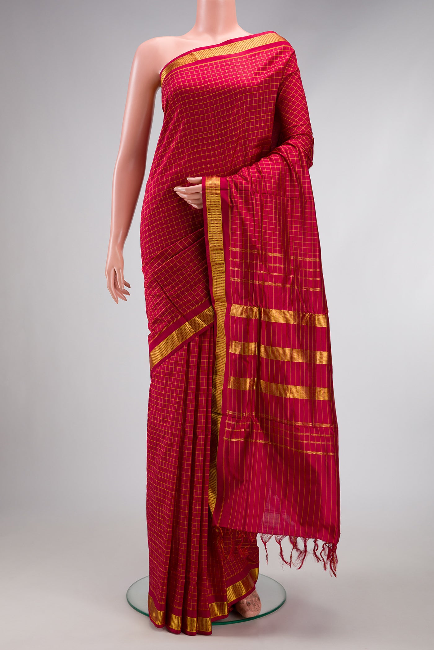 Maroon Kanjivaram Silk Nine Yards Saree with Checked design on the body and Zari Border.  displayed on a mannequin
