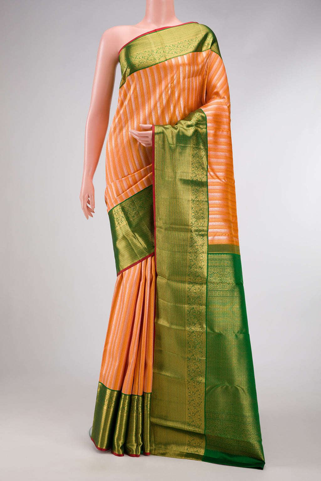Peach Dual Tone Kanchipuram Silk Saree with Zari Brocade on the body and Zari Border.  displayed on a mannequin