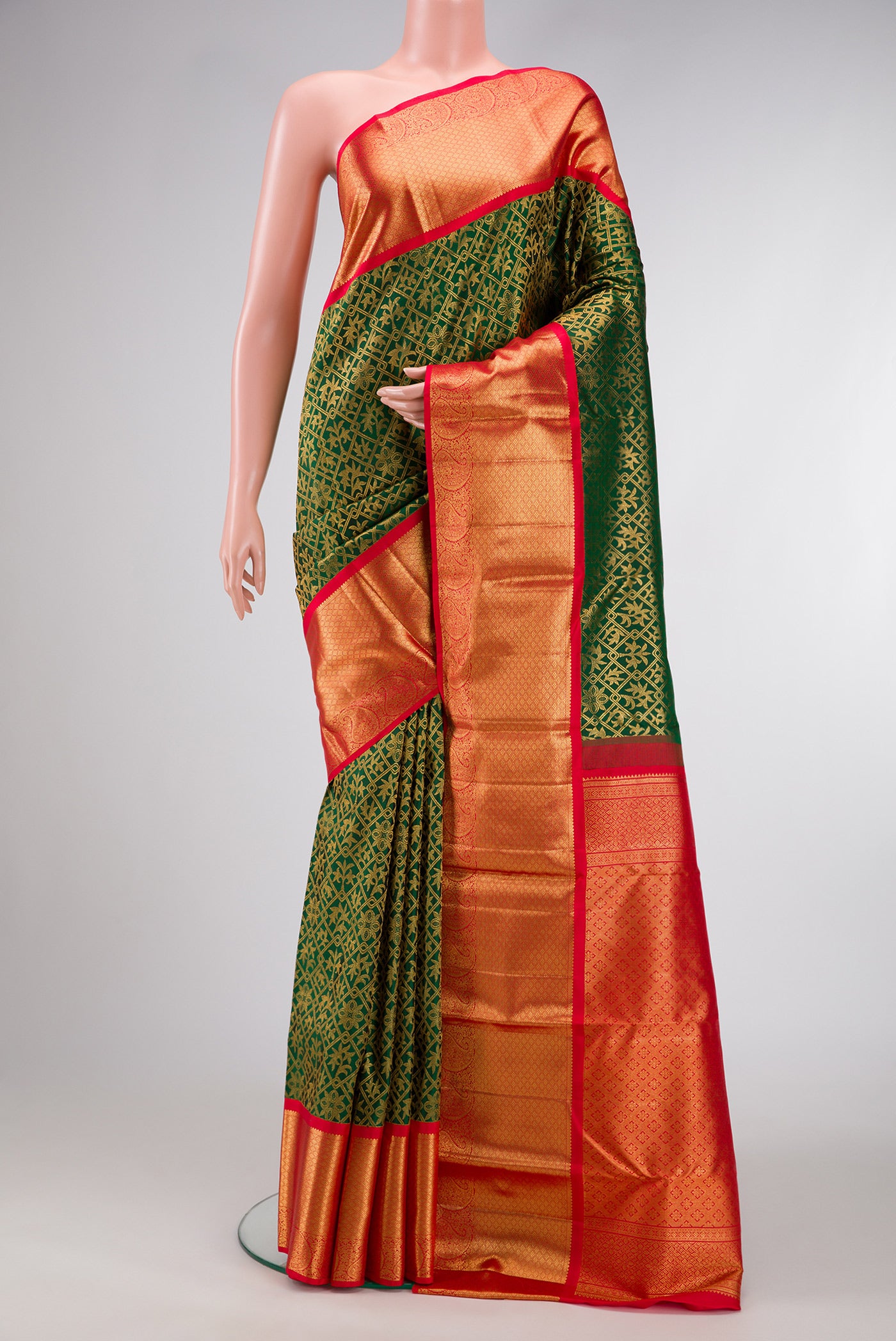 Green Dual Tone Kanjivaram Silk Saree with Zari Brocade on the body and Zari Border.  displayed on a mannequin