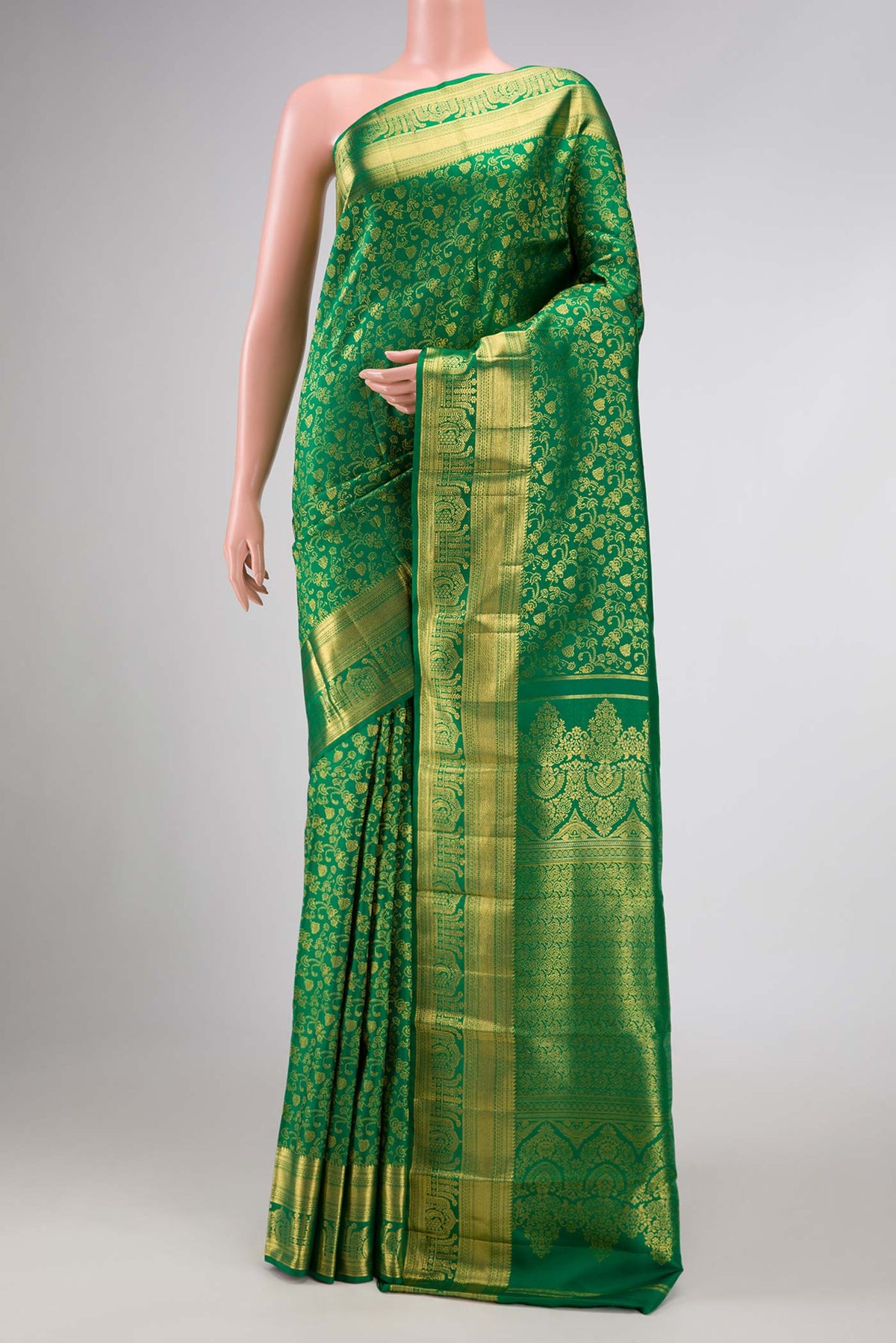 Green Dual Tone Kanchipuram Silk Saree with Zari Brocade on the body and Zari Border displayed on a mannequin
