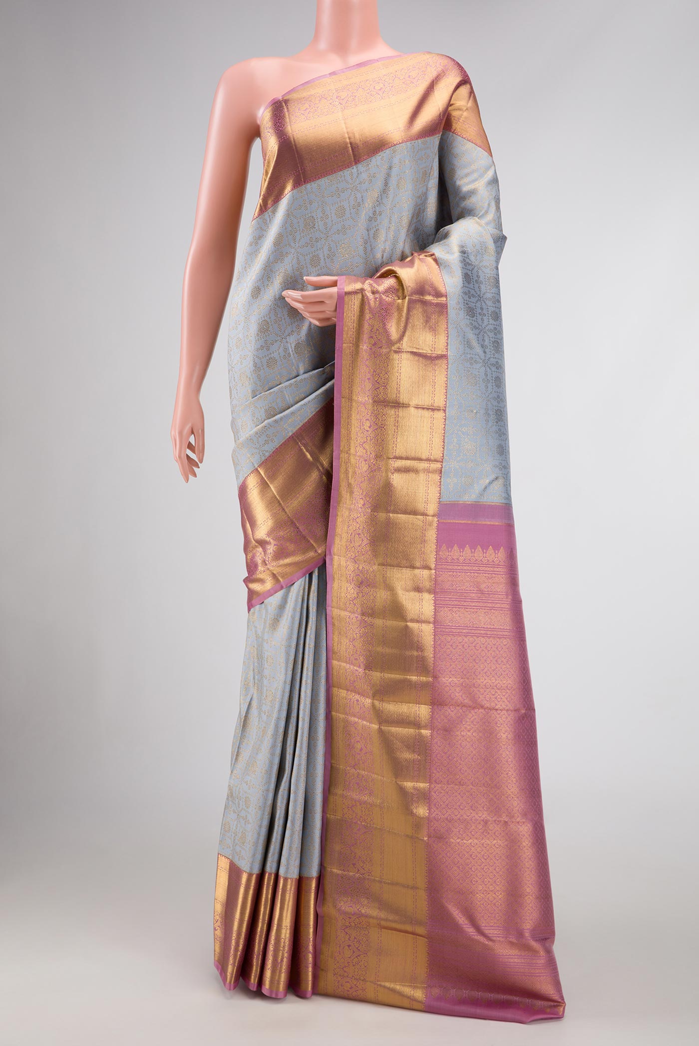 Grey Dual Tone Kanchipuram Silk Saree with Zari Brocade on the body and Zari Border.  displayed on a mannequin