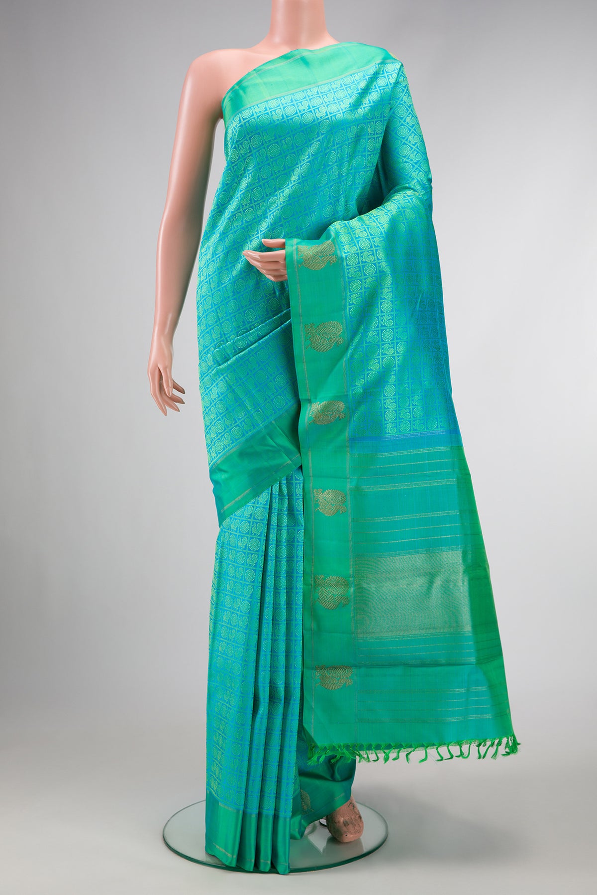Pure Silk Pure Zari Sea Green Dual Tone Kanjivaram Saree with Jacquard design on the body and Fancy Border.  displayed on a mannequin