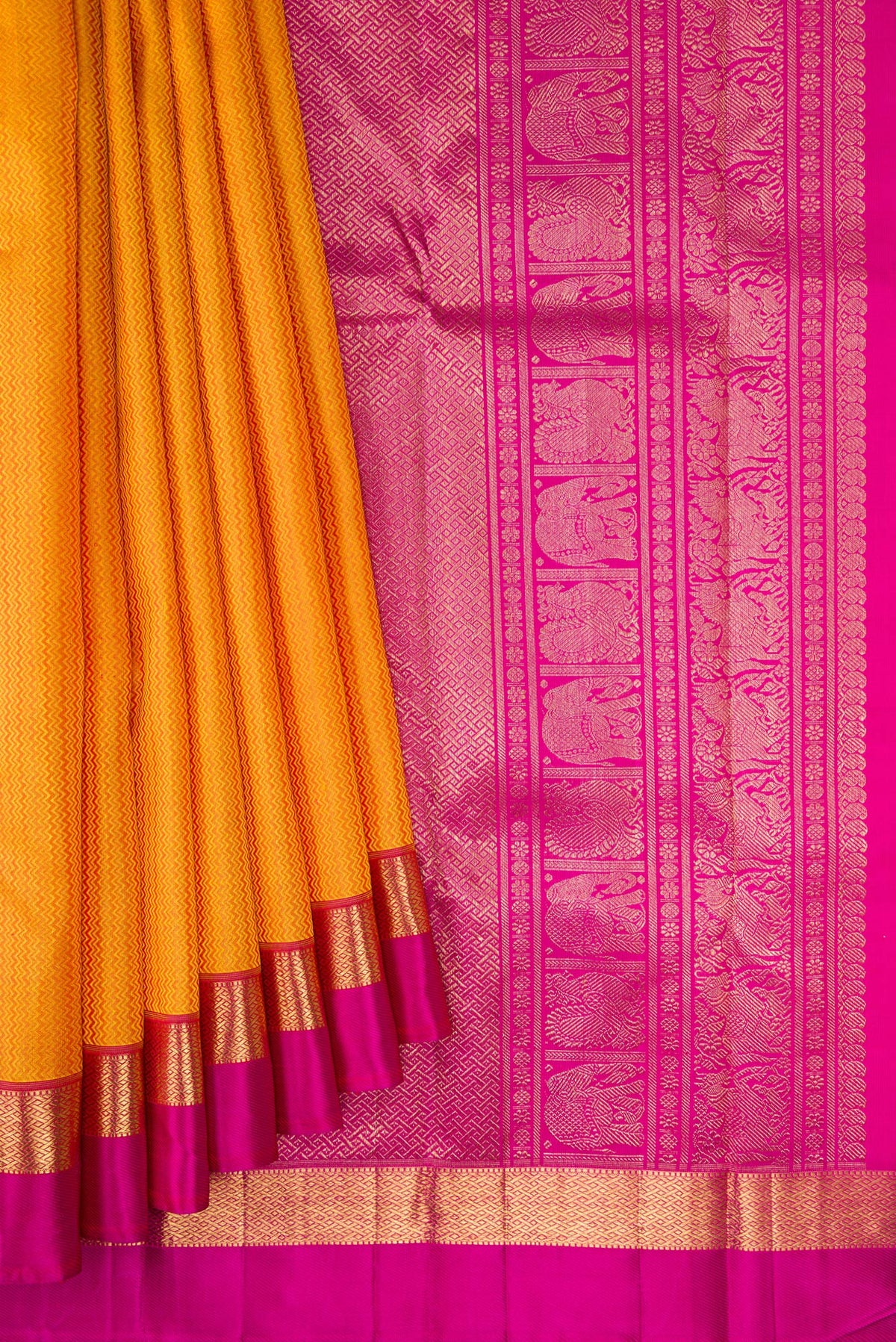 Pleats and pallu of Pure Silk Pure Zari Mustard Dual Tone Kanchipuram Saree with Jacquard design on the body and Zari And Thread Border. 