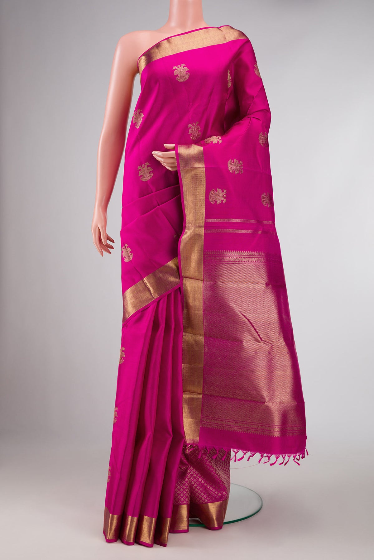 Pure Silk Pure Zari Pink Dual Tone Kanchipuram Saree with Zari Butta on the body and Zari Border displayed on a mannequin