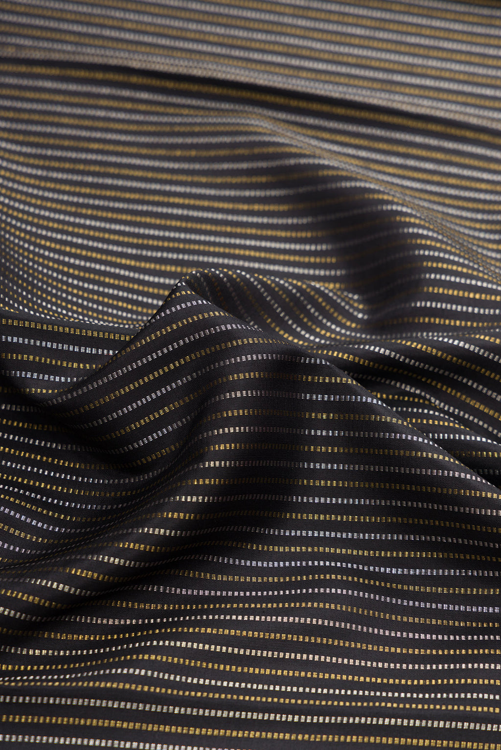 Close up of Pure Silk Pure Zari Black Dual Tone Kanchipuram Saree with Stripes on the body and Zari Border.  displaying folds