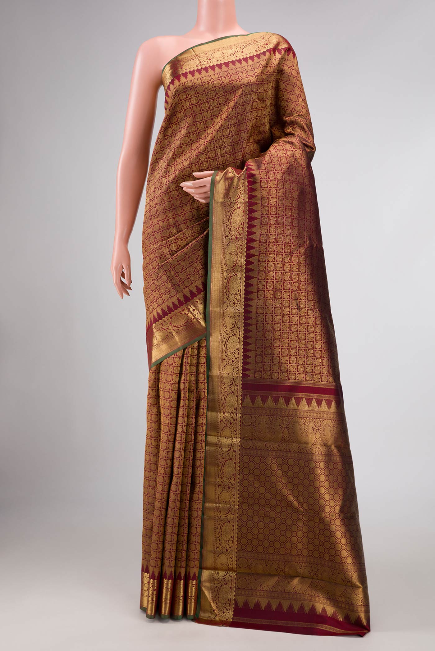 Maroon Dual Tone Kanchipuram Silk Saree with Zari Brocade on the body and Zari Border displayed on a mannequin