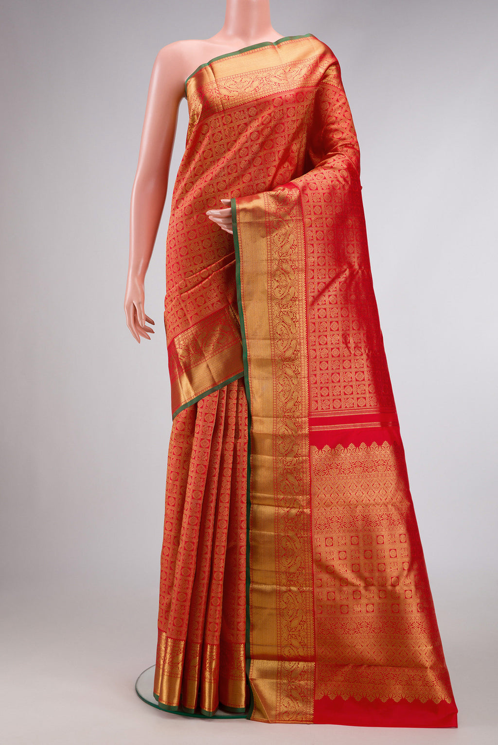 Pure Silk Pure Zari Red Dual Tone Kanjivaram Saree with Zari Brocade on the body and Zari Border.  displayed on a mannequin