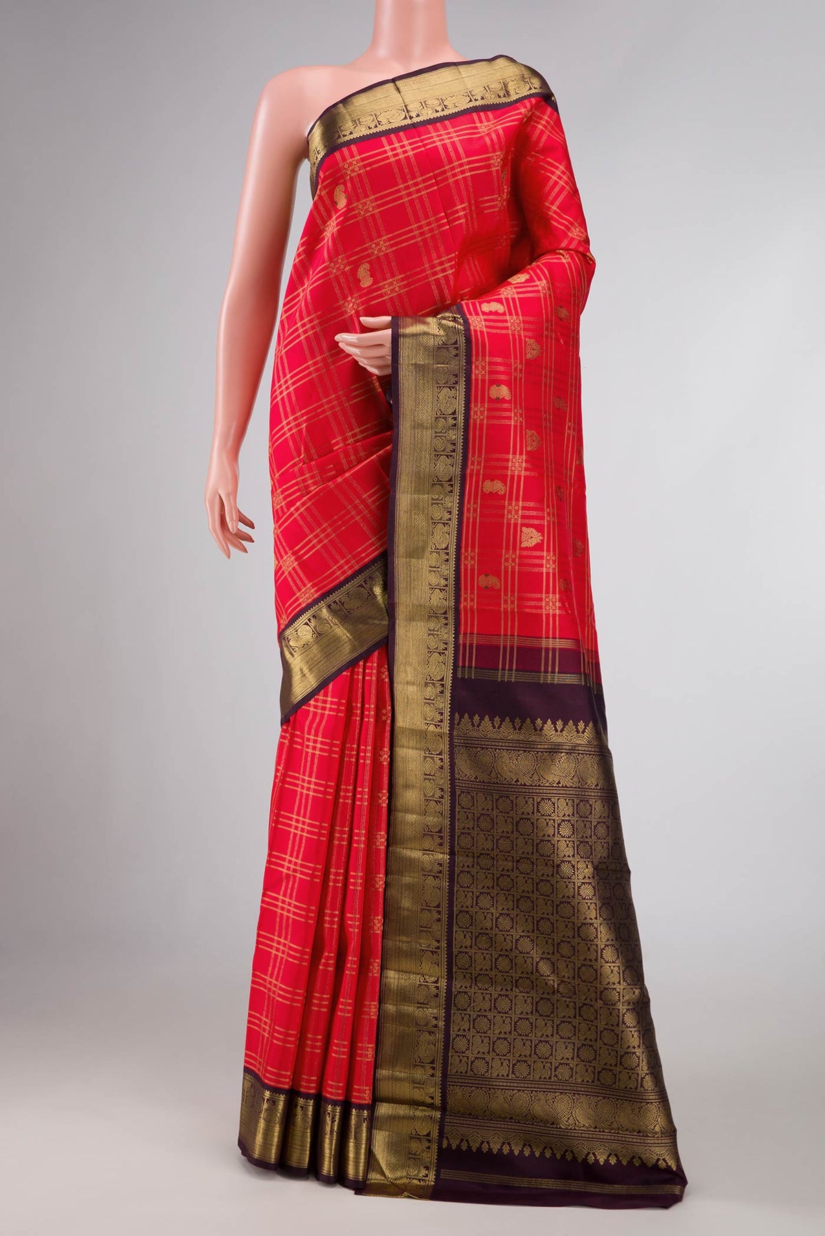 Red Dual Tone Kanchipuram Silk Saree with Checked design on the body and Zari Border displayed on a mannequin