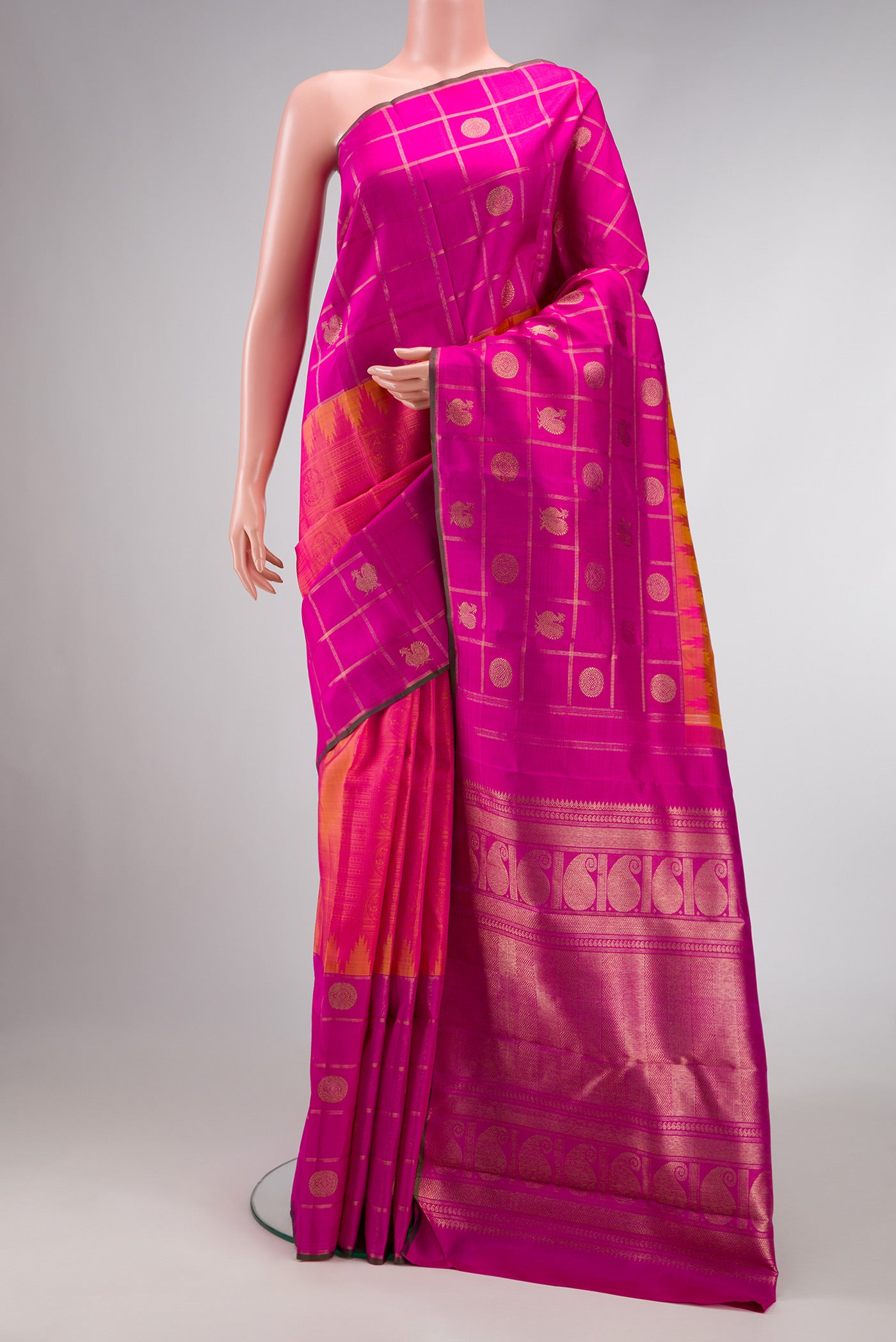 Pure Silk Pure Zari Coral Dual Tone Kanchipuram Saree with Jacquard design on the body and Checks Border.  displayed on a mannequin