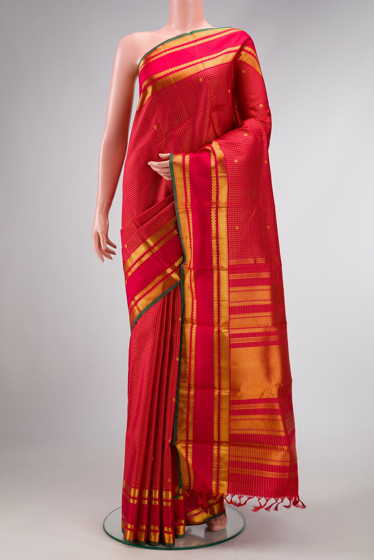 Deep Red Dual Tone Kanjivaram Silk Saree with Checked design on the body and Zari Border.  displayed on a mannequin