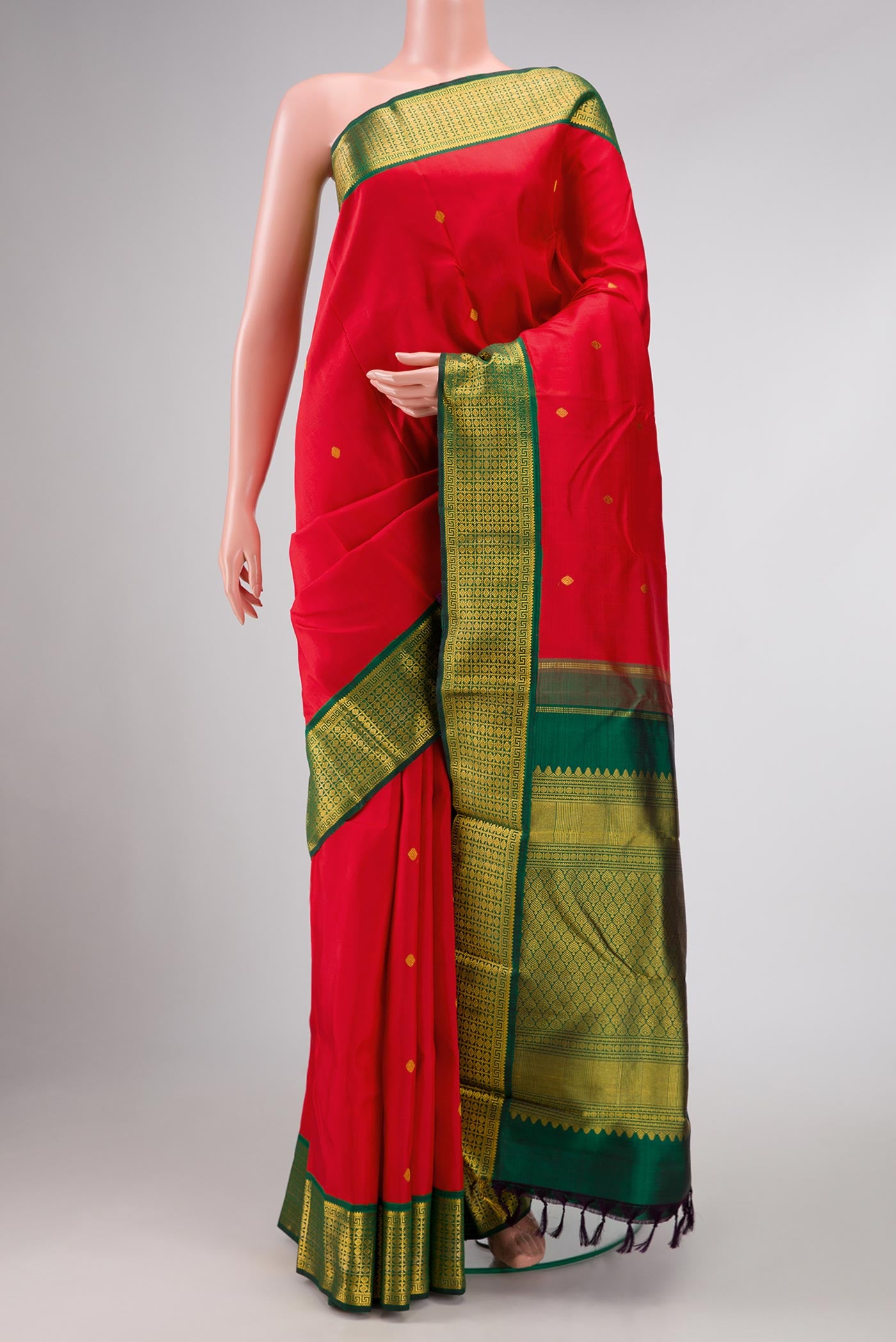 Red Dual Tone Kanchipuram Silk Saree with Zari Butta on the body and Zari Border displayed on a mannequin