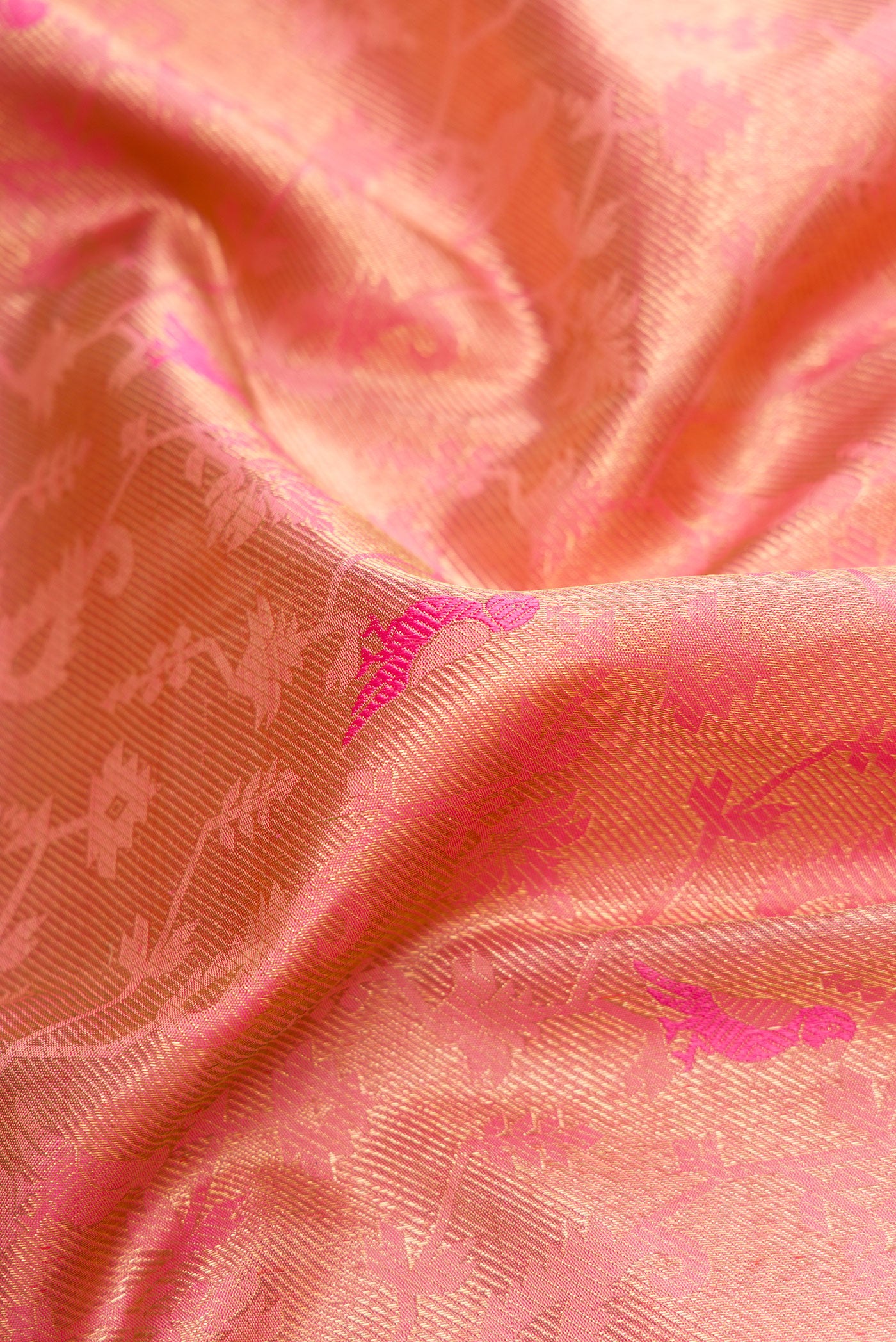Close up of Pure Silk Pure Zari Pink Dual Tone Kanjivaram Saree with Zari Brocade on the body and Zari Border.  displaying folds