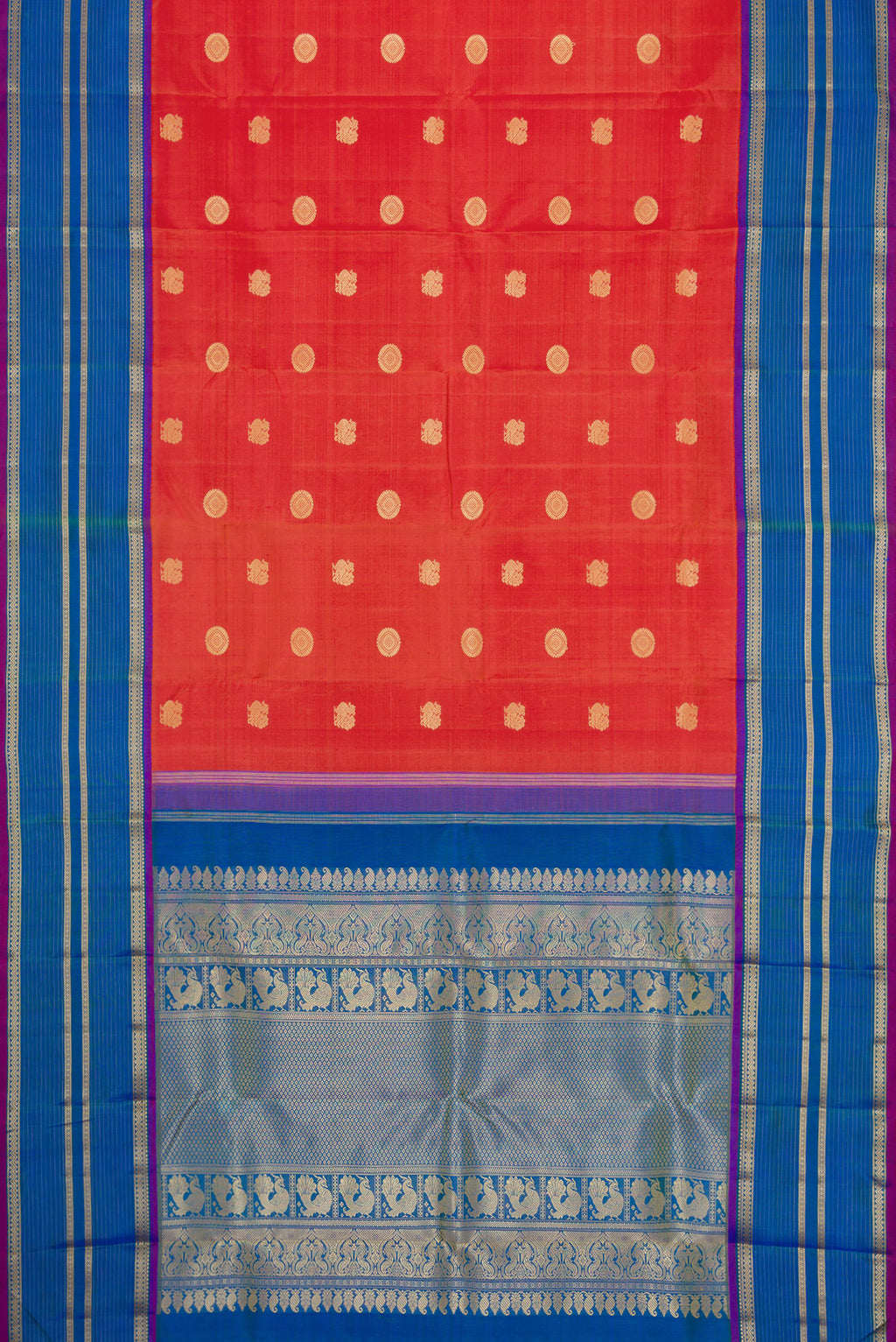 Flat view of Orange Dual Tone Kanchipuram Silk Saree with Thread Butta on the body and Thread Border. 