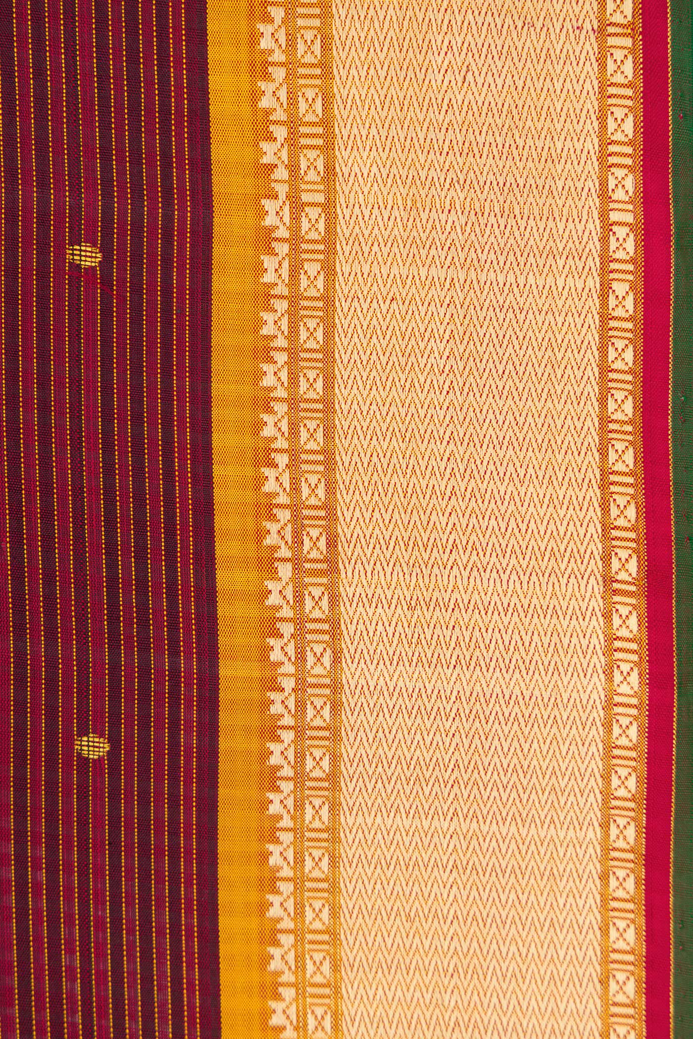 Border image of Pure Silk Pure Zari Maroon Dual Tone Kanchipuram Saree with Zari And Thread Butta on the body and Thread Border. 