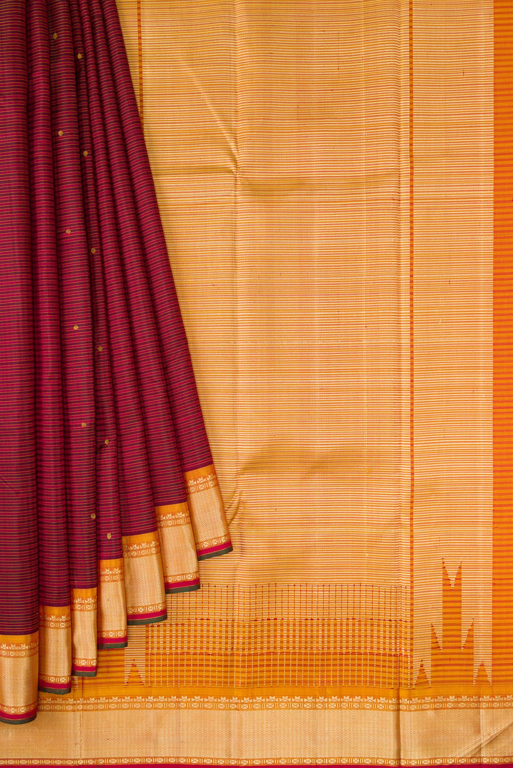 Pleats and pallu of Pure Silk Pure Zari Maroon Dual Tone Kanchipuram Saree with Zari And Thread Butta on the body and Thread Border. 